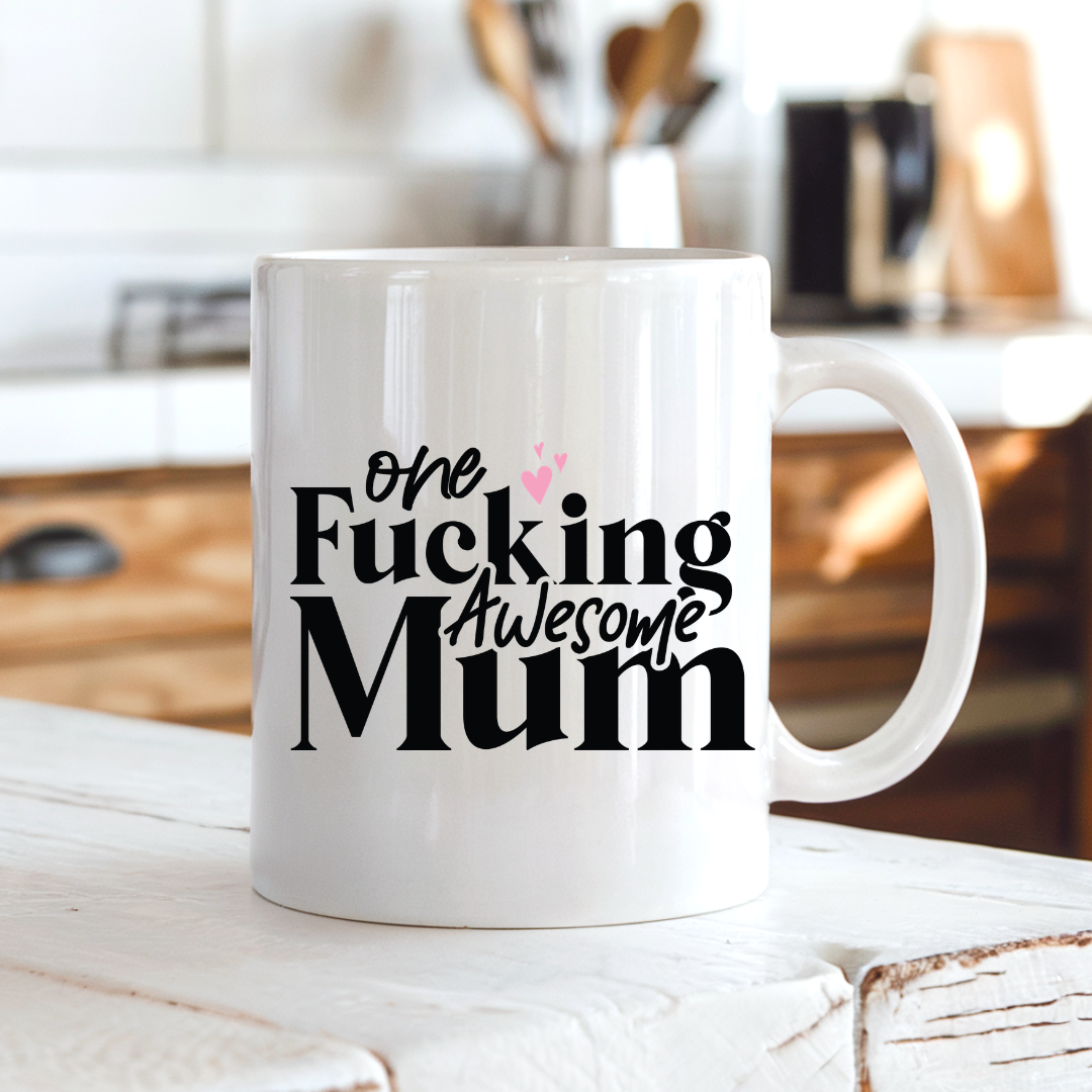 One Fucking Awesome Mum funny coffee mug on a country kitchen bench, adding bold humour to a rustic setting, by Coffee and Moo.