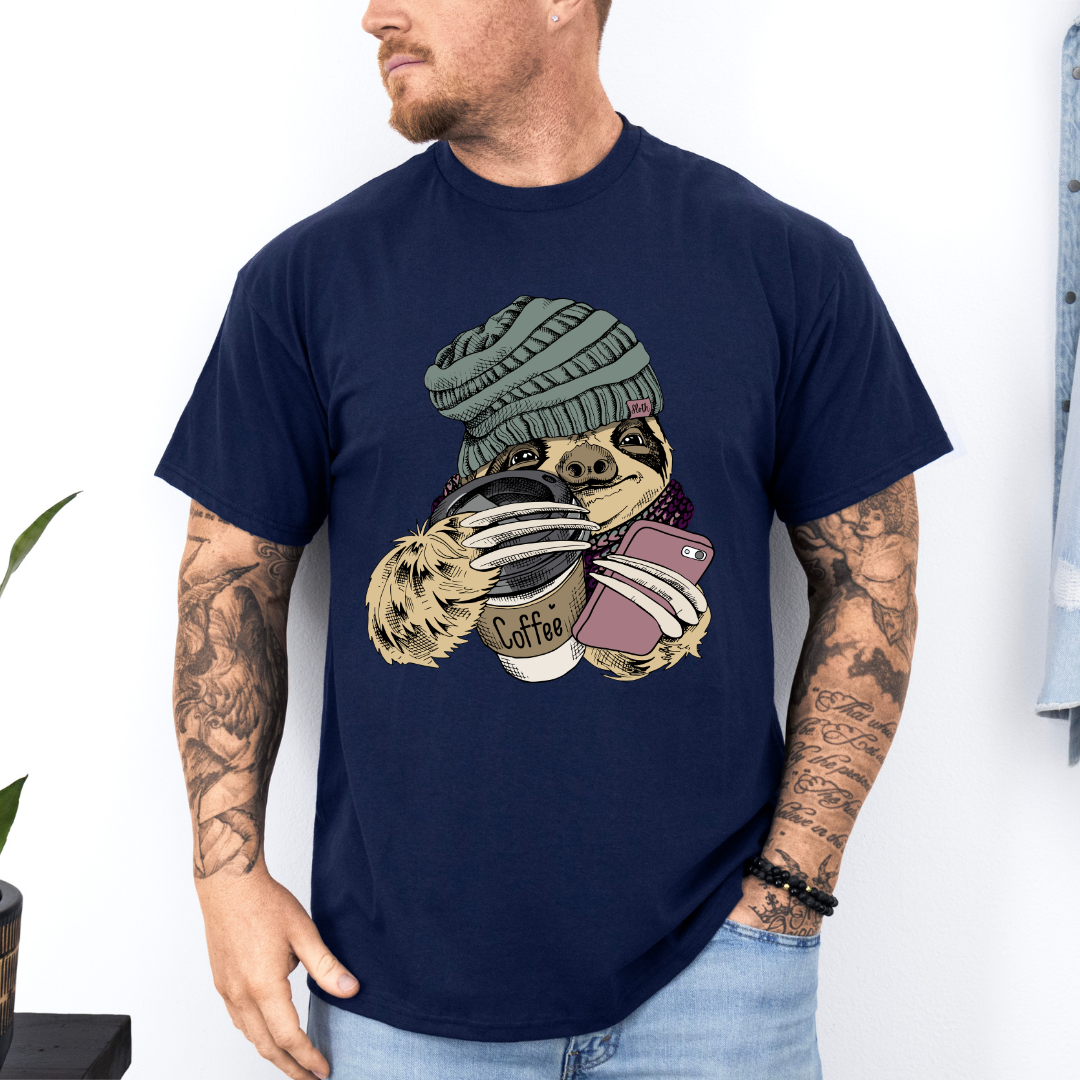 Male Model wearing a navy Cozy Coffee Sloth soft graphic t-shirt, showcasing its unique design and comfortable fit from Coffee and Moo.