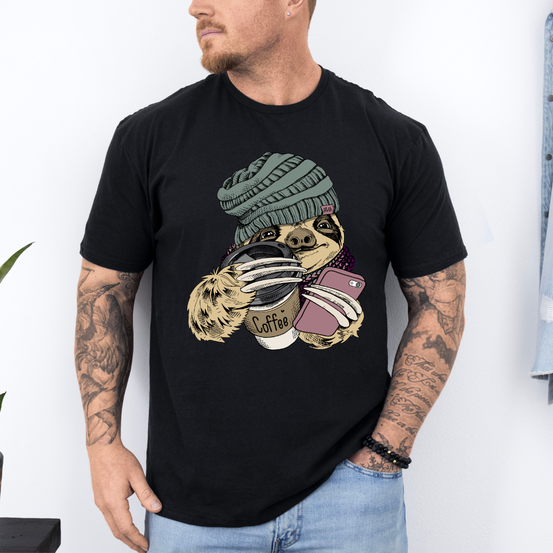 Male Model wearing a black Cozy Coffee Sloth soft graphic t-shirt, showcasing its unique design and comfortable fit from Coffee and Moo.