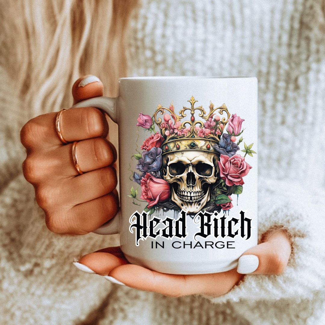 Female holding Head Bitch In Charge unique gift mug, highlighting the bold gothic aesthetic, from Coffee and Moo.