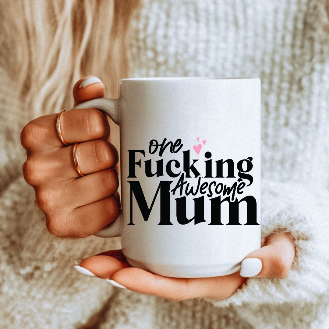 Female holding One Fucking Awesome Mum unique coffee mug, highlighting the "One fucking awesome mum" design, from Coffee and Moo.