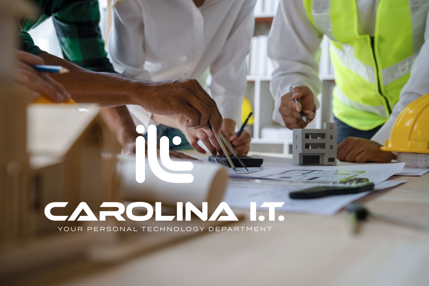 People working on construction or architecture planning with blueprints and tools on a table, wearing safety vests and a helmet.