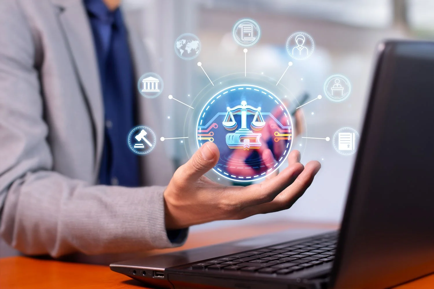 A person in a suit using a laptop with a holographic display of legal symbols, including scales of justice, surrounded by icons representing various legal and governmental concepts. The person is pointing at the holographic display.