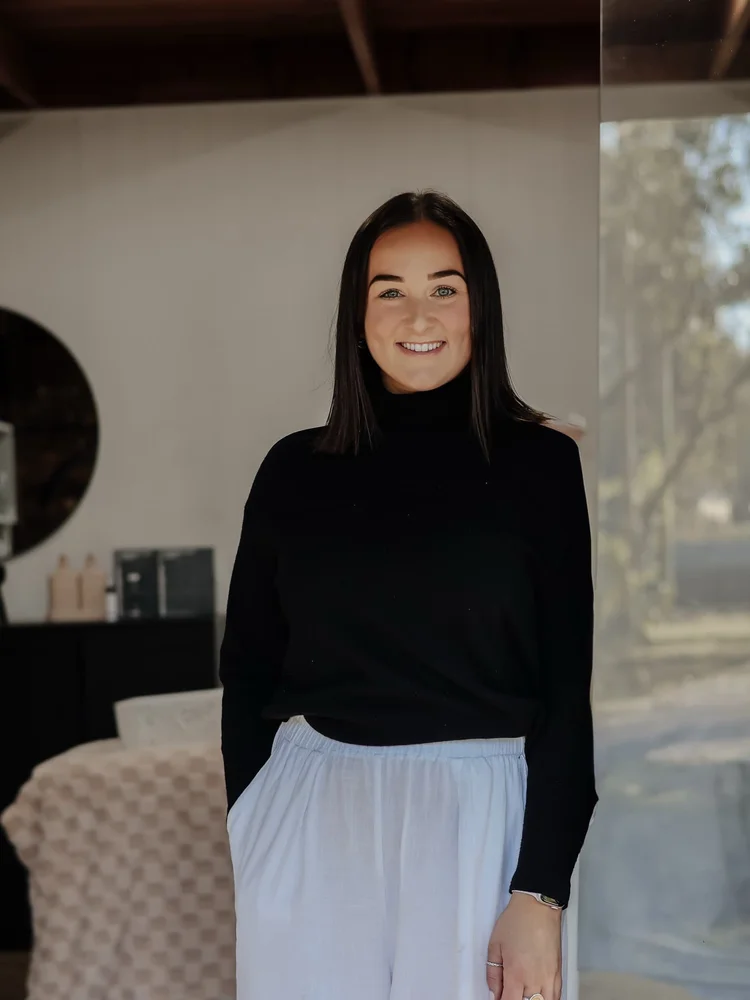 Maddi, founder of Maddi's House of Beauty, standing in the salon
