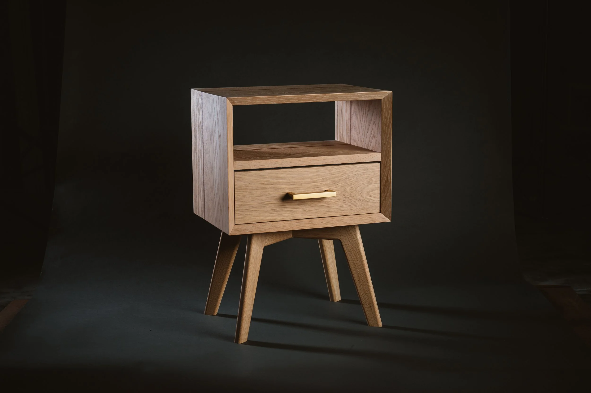 White oak nightstand with brass accents and sliding drawer
