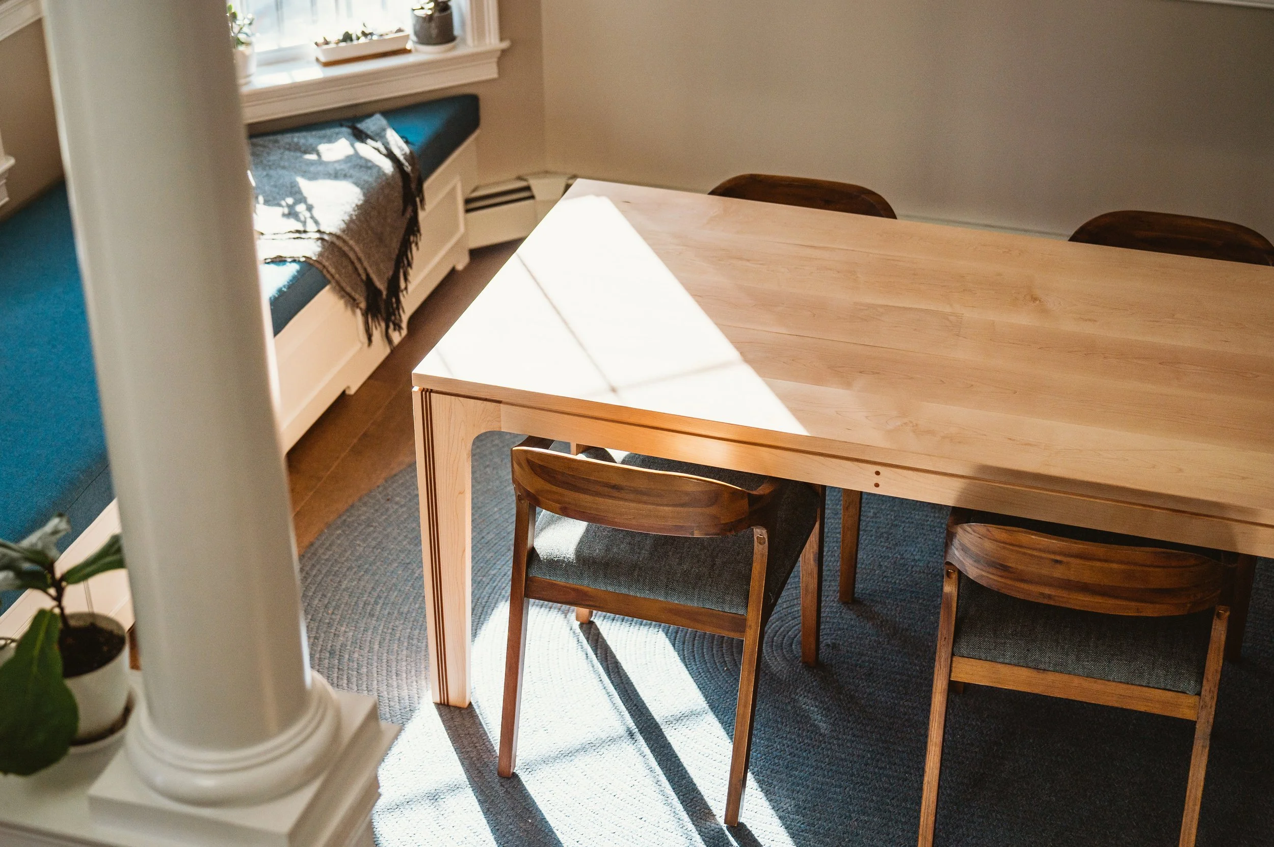 Dining table with floating top in hard maple