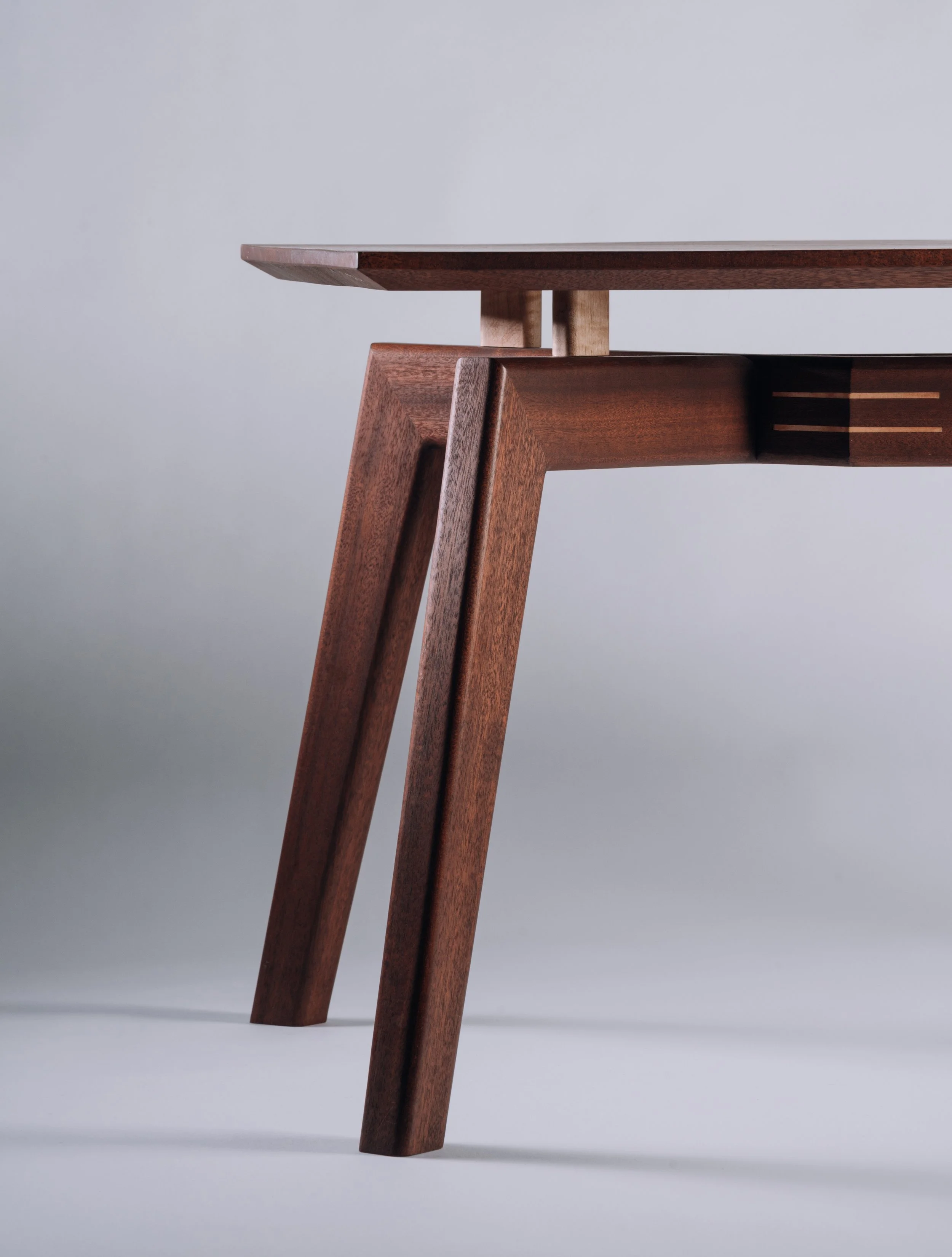 Contrasting wood species detail of maple and sapele coffee table
