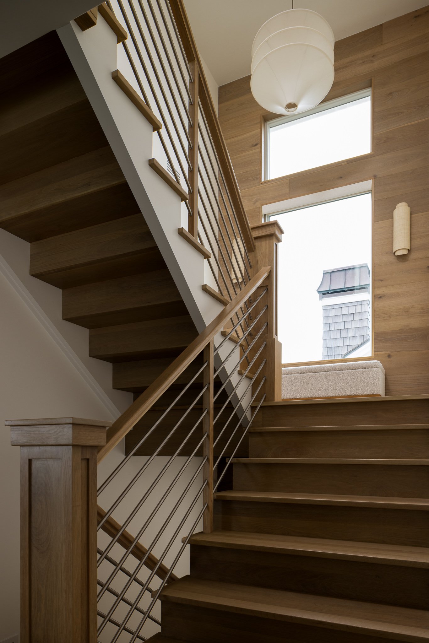 custom metal railing with light millwork stairway