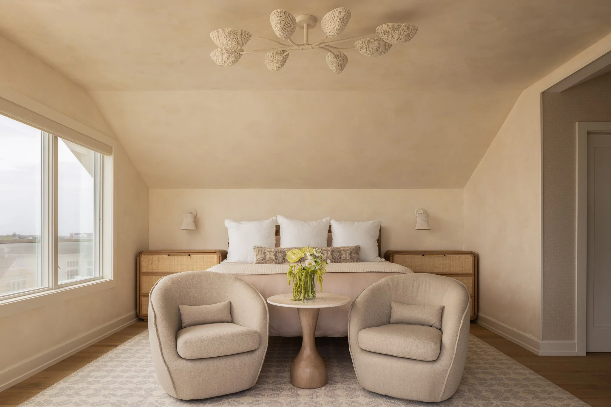 light king sized bed with sconces and chandelier that blend in