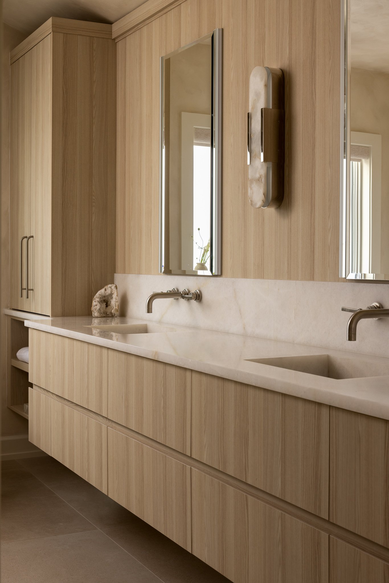 light bright marble double vanity with silver fixtures