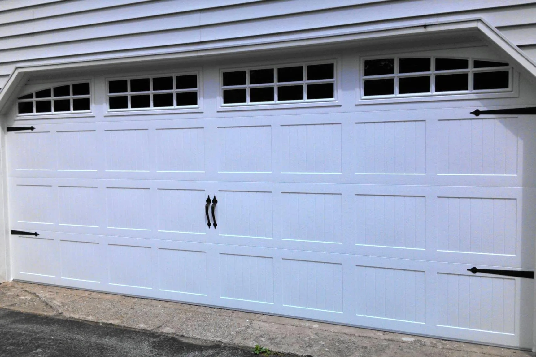 One Stamped Carriage House Garage Door on Paneled House