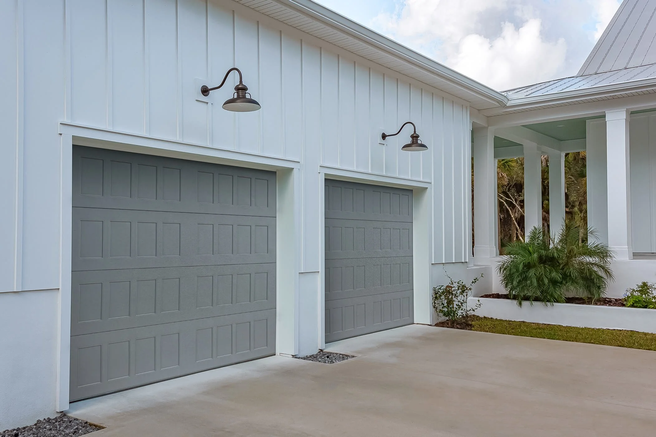 Two Gray Stamped Shaker Garage Doors