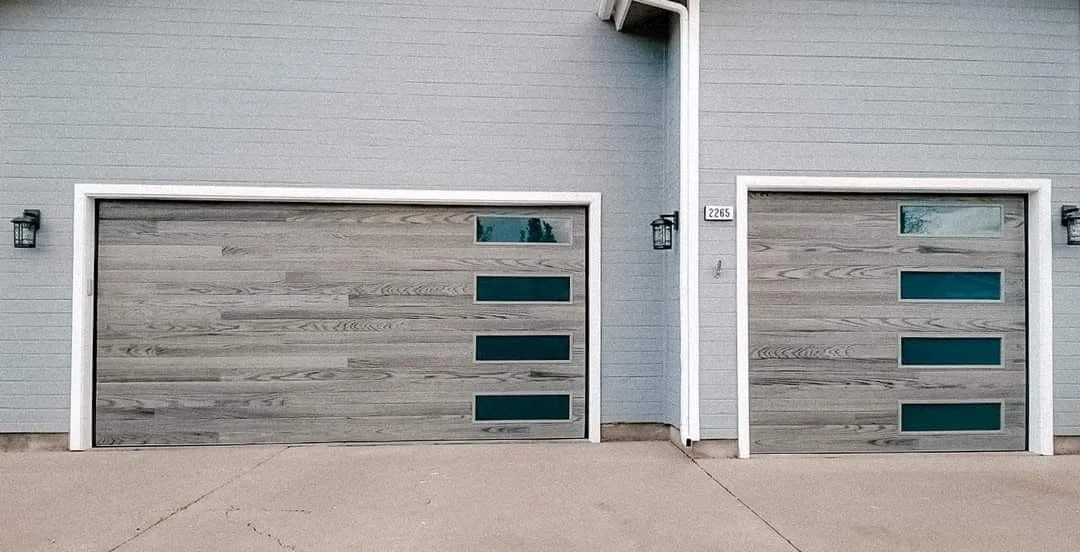 Two Gray Plank Garage Doors on Gray House