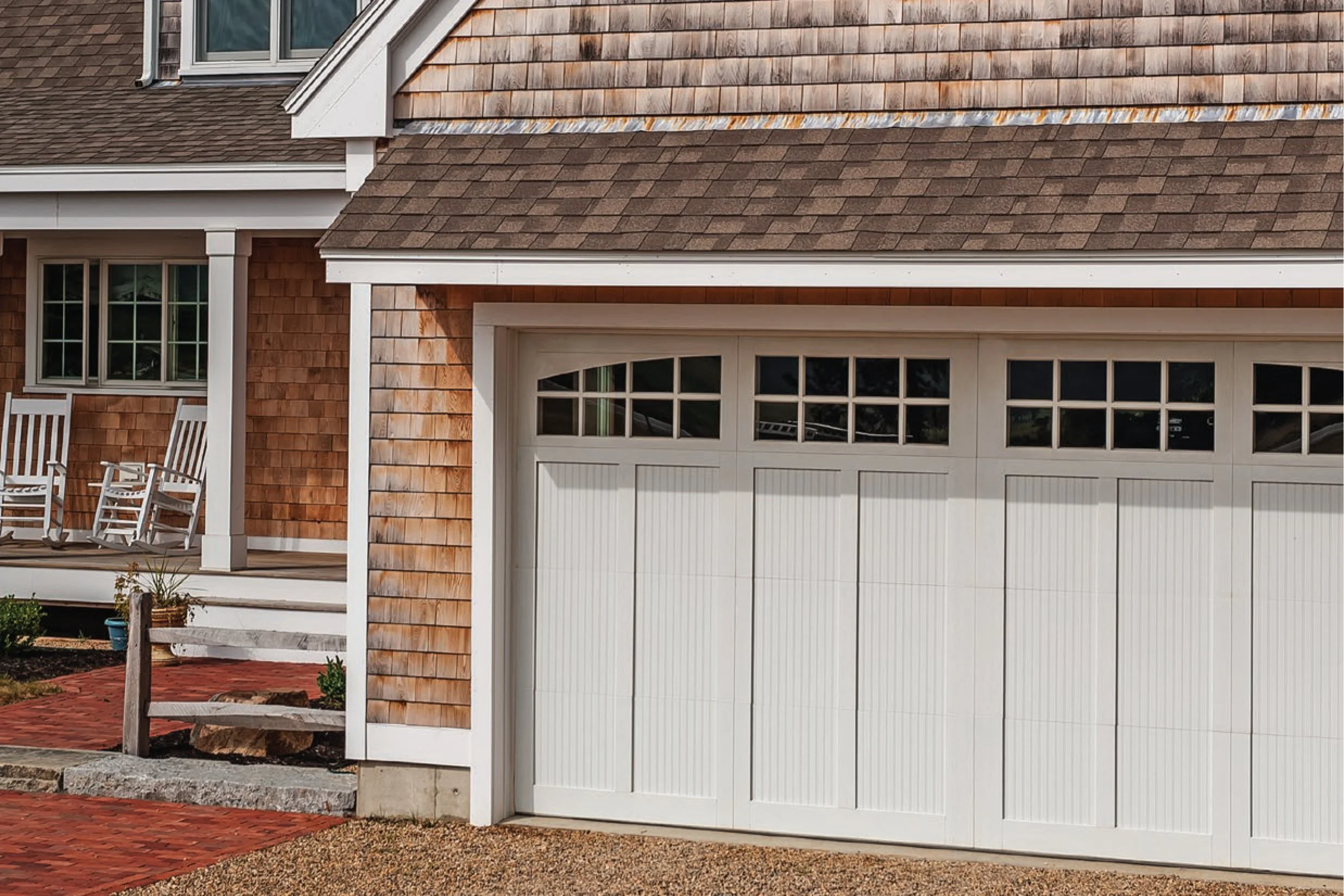 White Carriage Collection Garage Door on Wood Paneled House