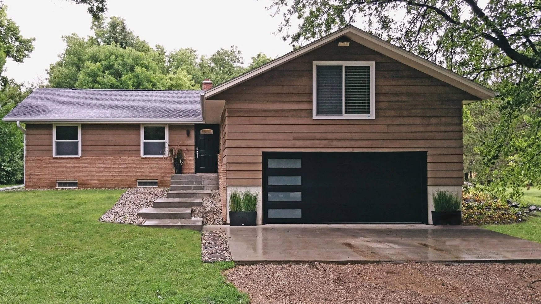 Black Skyline Garage Door on Wooden House