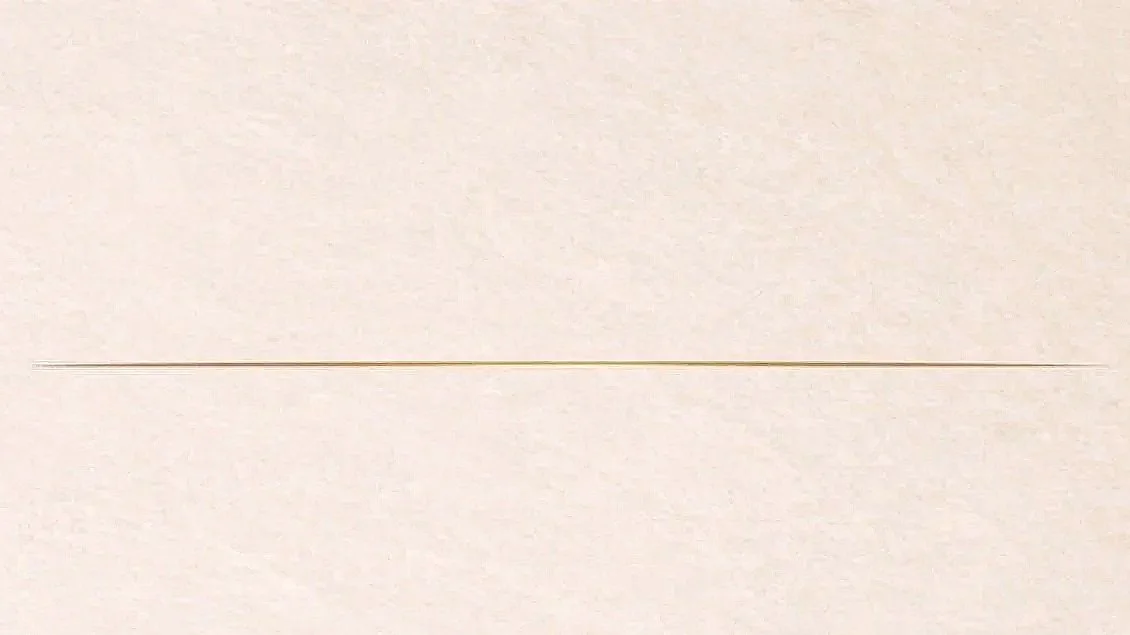 Close-up of a plain, light-colored surface with a thin horizontal line.