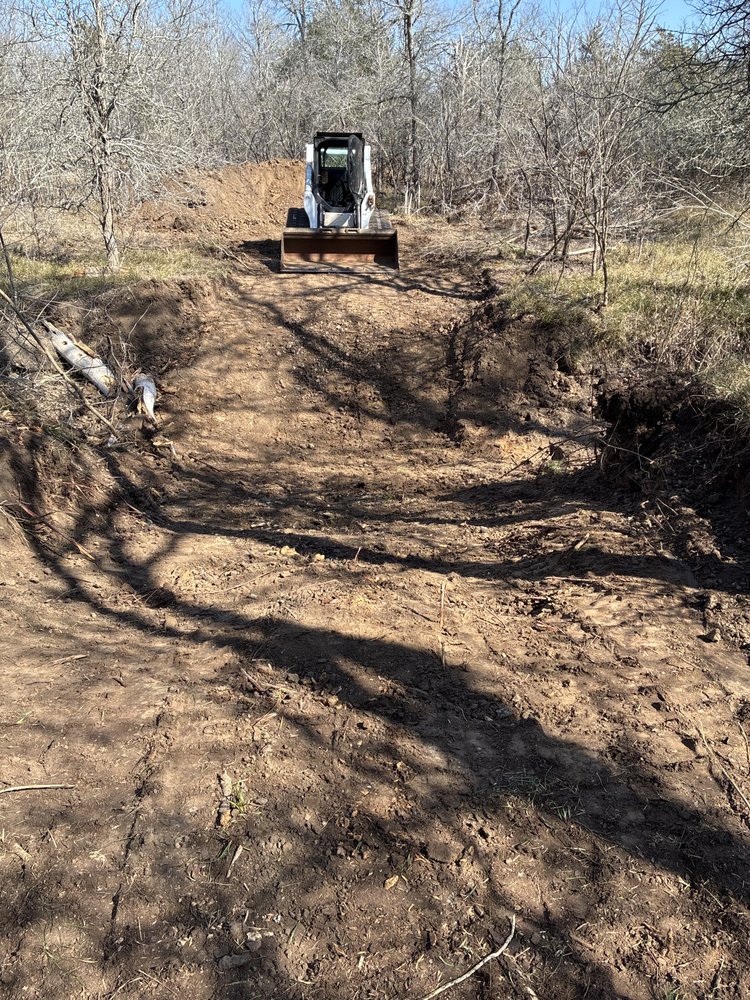 Excavator creating a ranch access road