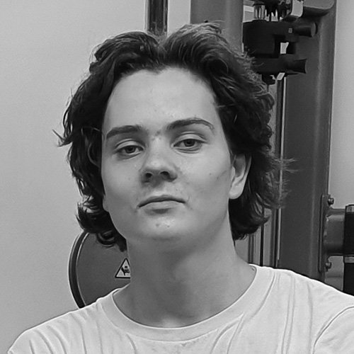 Silhouette of a person's head and shoulders against a black background, illuminated from behind with a rim of white light outlining the hair and ears.