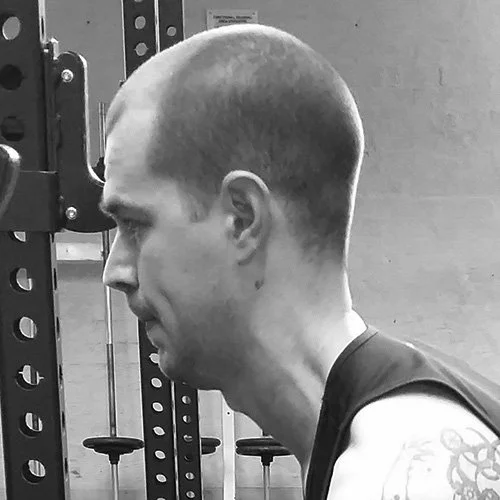 Silhouette of a person with backlit hair against a black background.