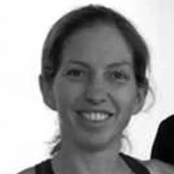 Silhouette of a person with backlighting, showcasing only the outline of their head and shoulders against a dark background.