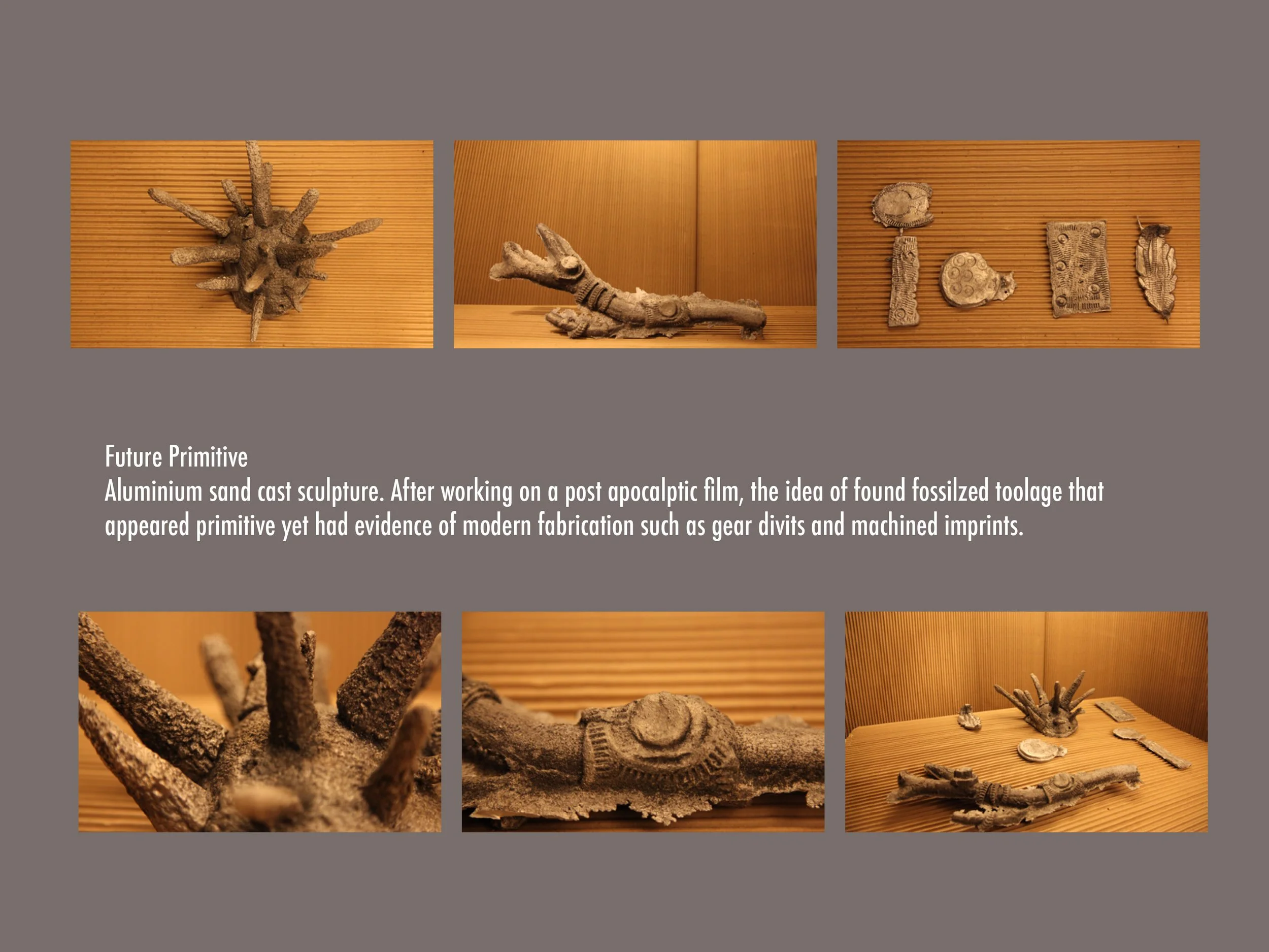 Display of fossilized aluminum sand cast sculptures resembling primitive tools and gear imprints, displayed on wooden backgrounds.