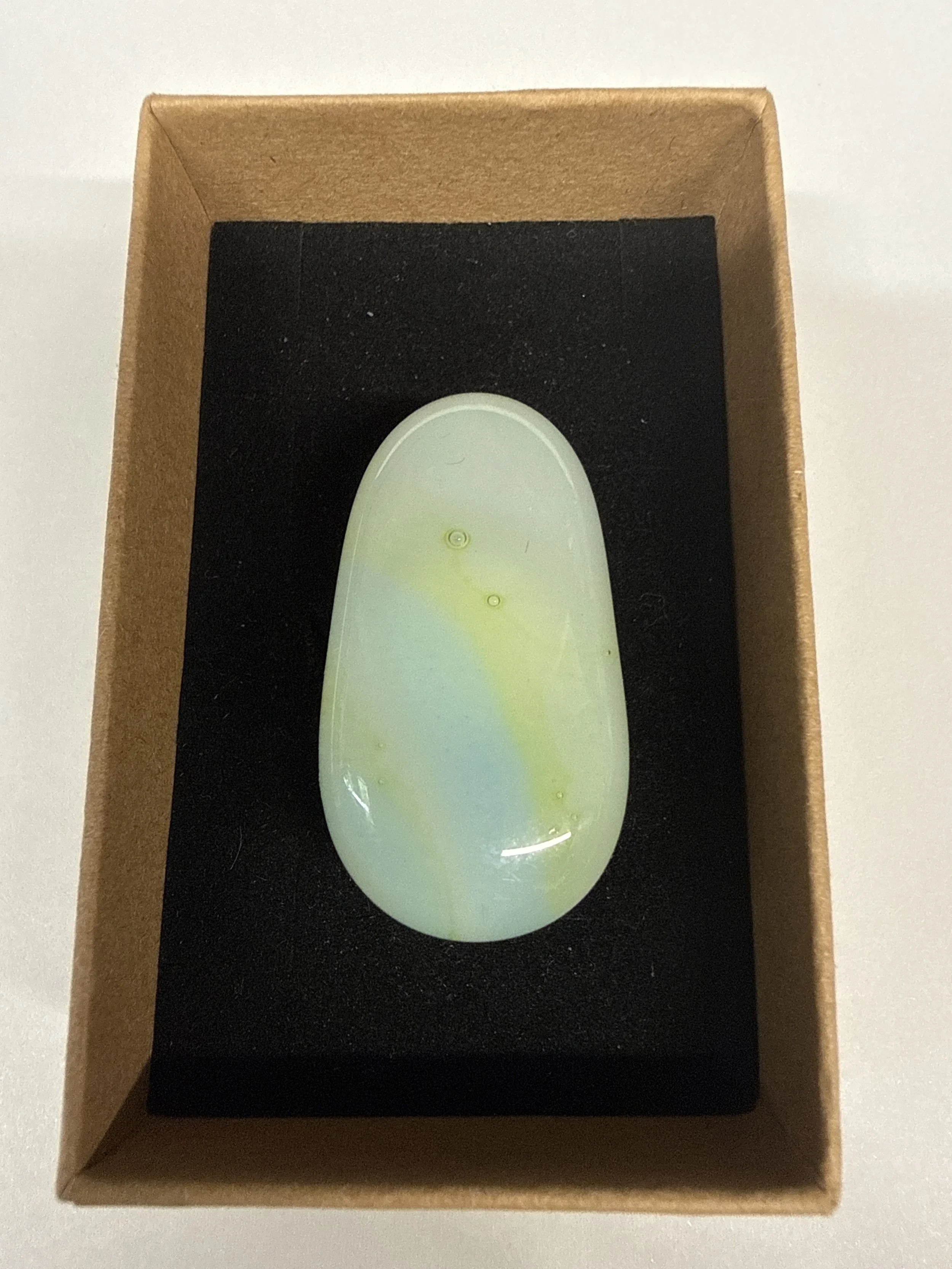 Oval shape Ring White blue and yellow hue