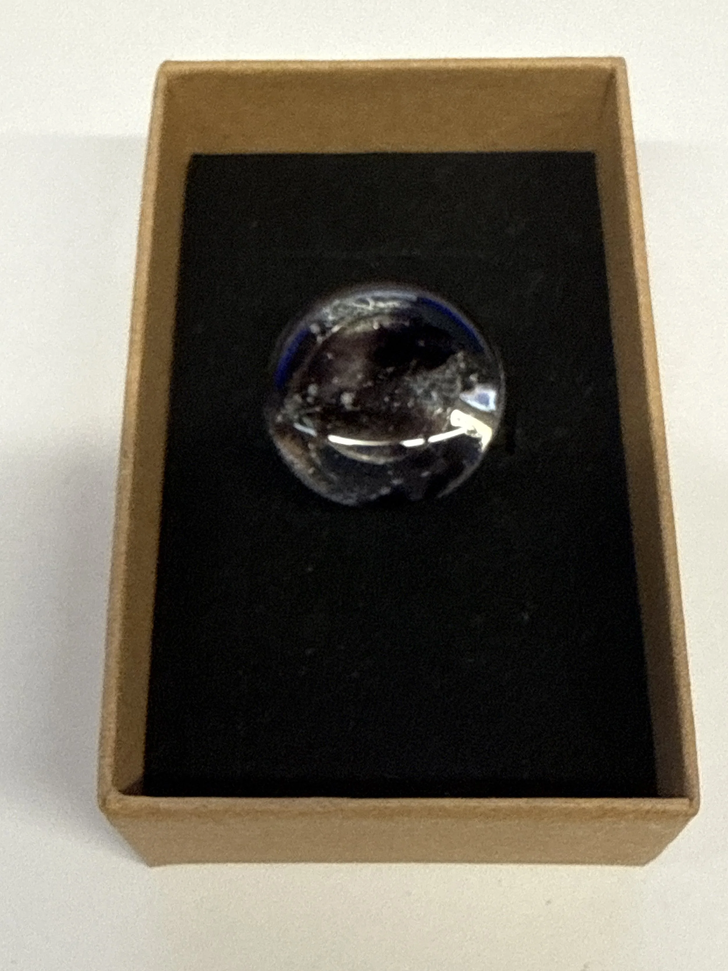 Round shape clear with purple flecks