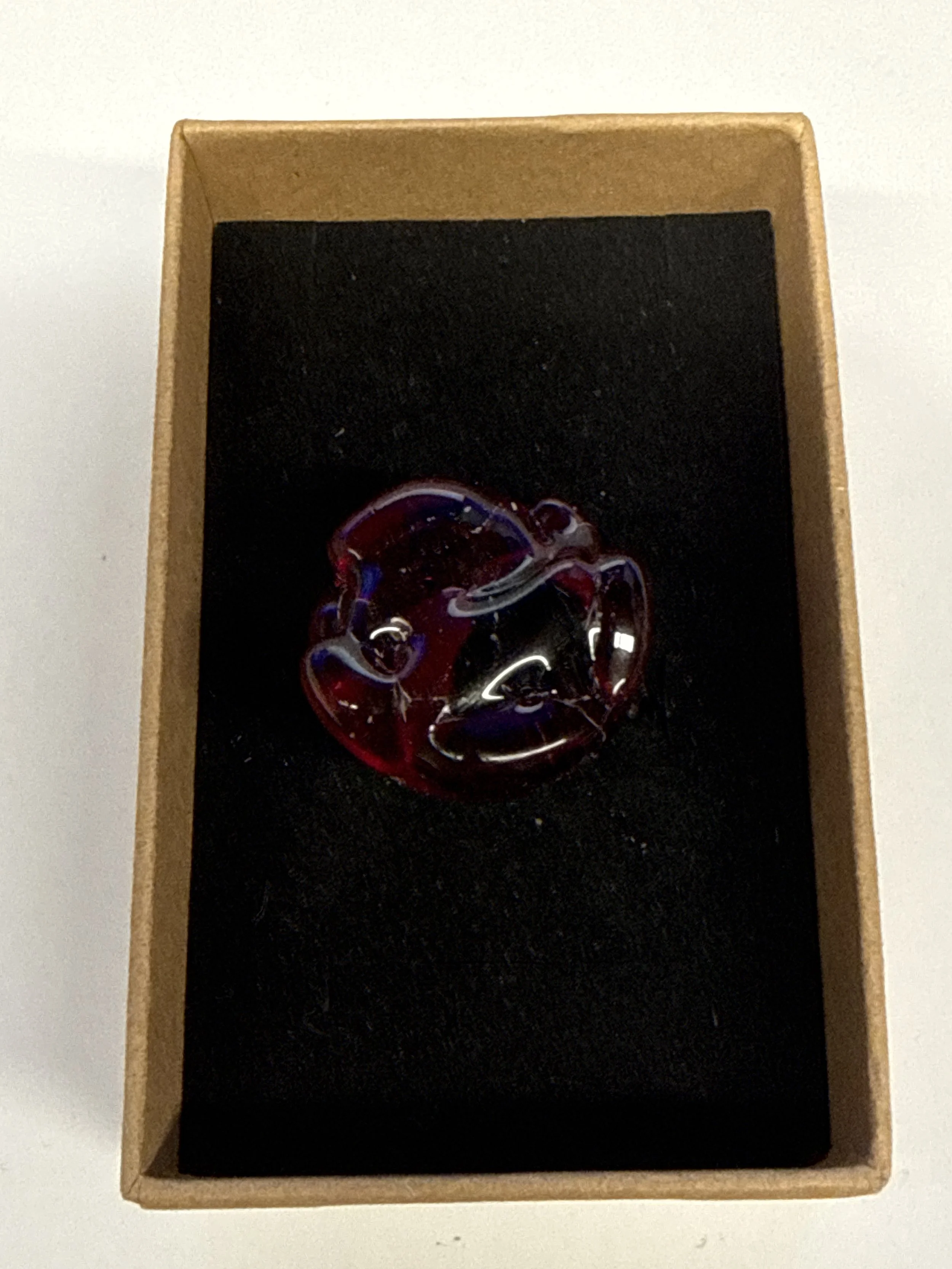 Round shape Red with black centre