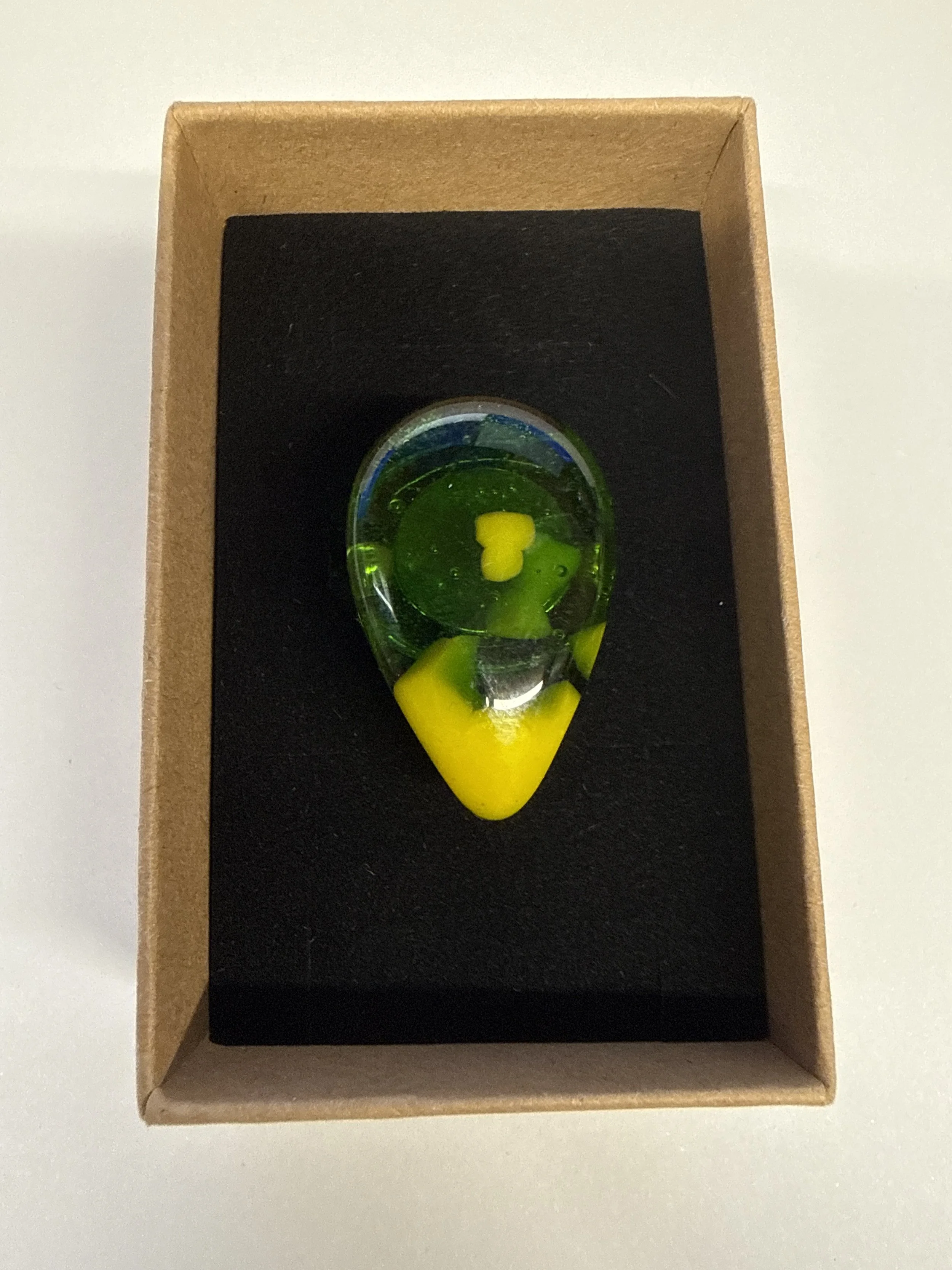 Teardrop shape transparent green with yellow