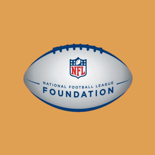 An American football with the NFL Foundation logo on it, placed against a tan background.