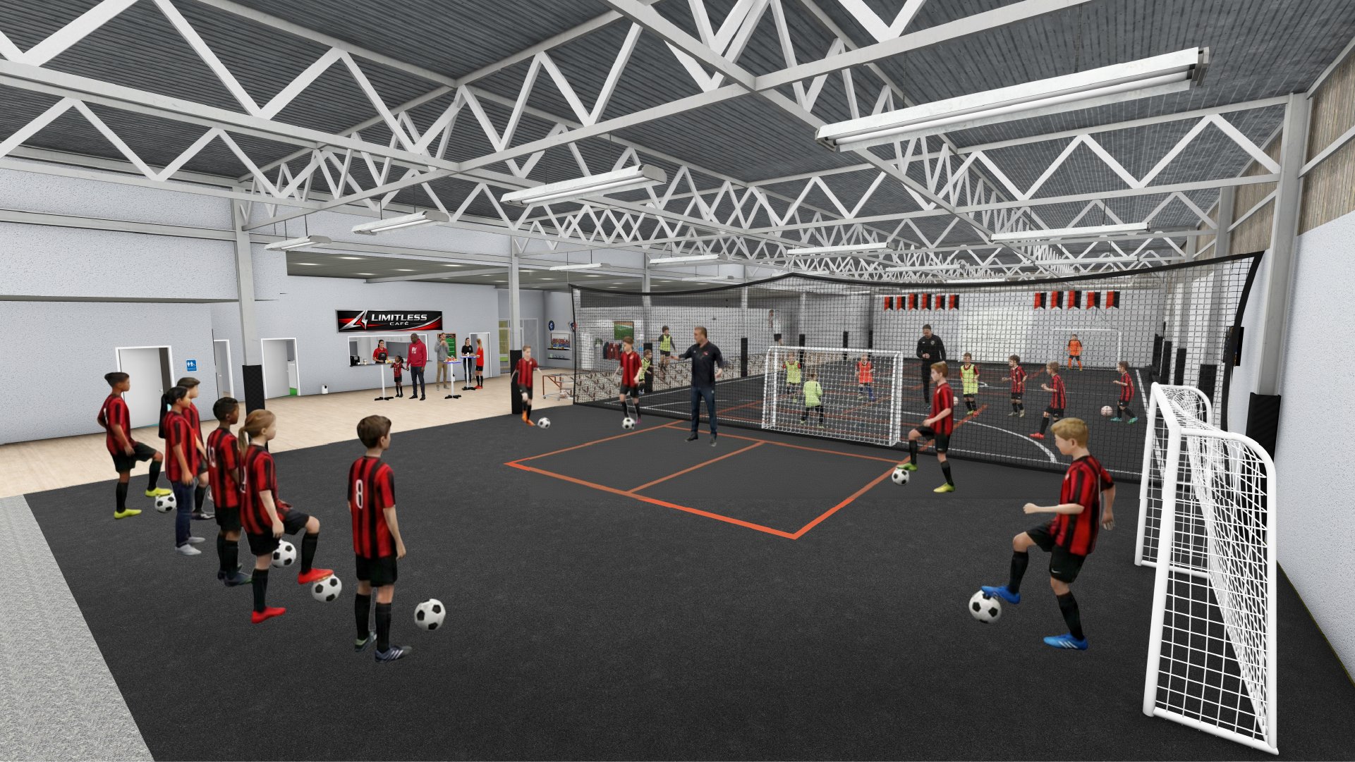 Indoor futsal training session with children and coaches, some children practicing ball control, others playing within a fenced goal area, with a reception counter labeled "Limitless Cafe" in the background.
