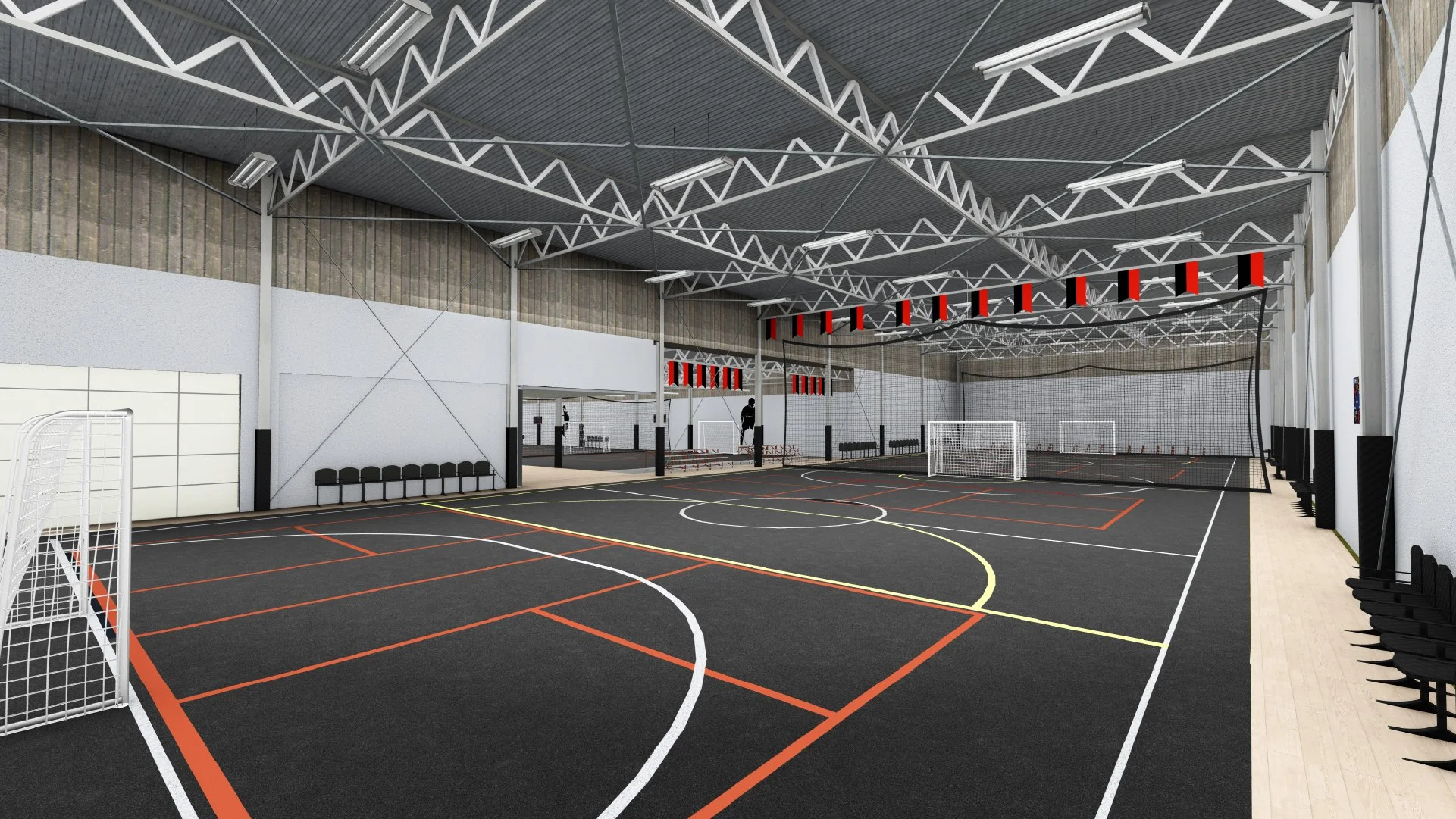 Indoor sports facility with multiple futsal courts, seating along the walls, and a high ceiling with steel beams.