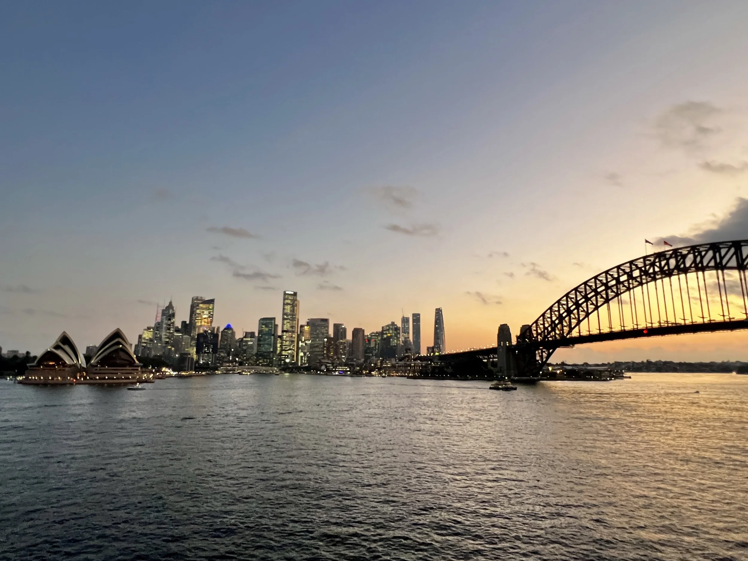Sydney Opera House and Harbour Bridge at sunset in Sydney, Australia.