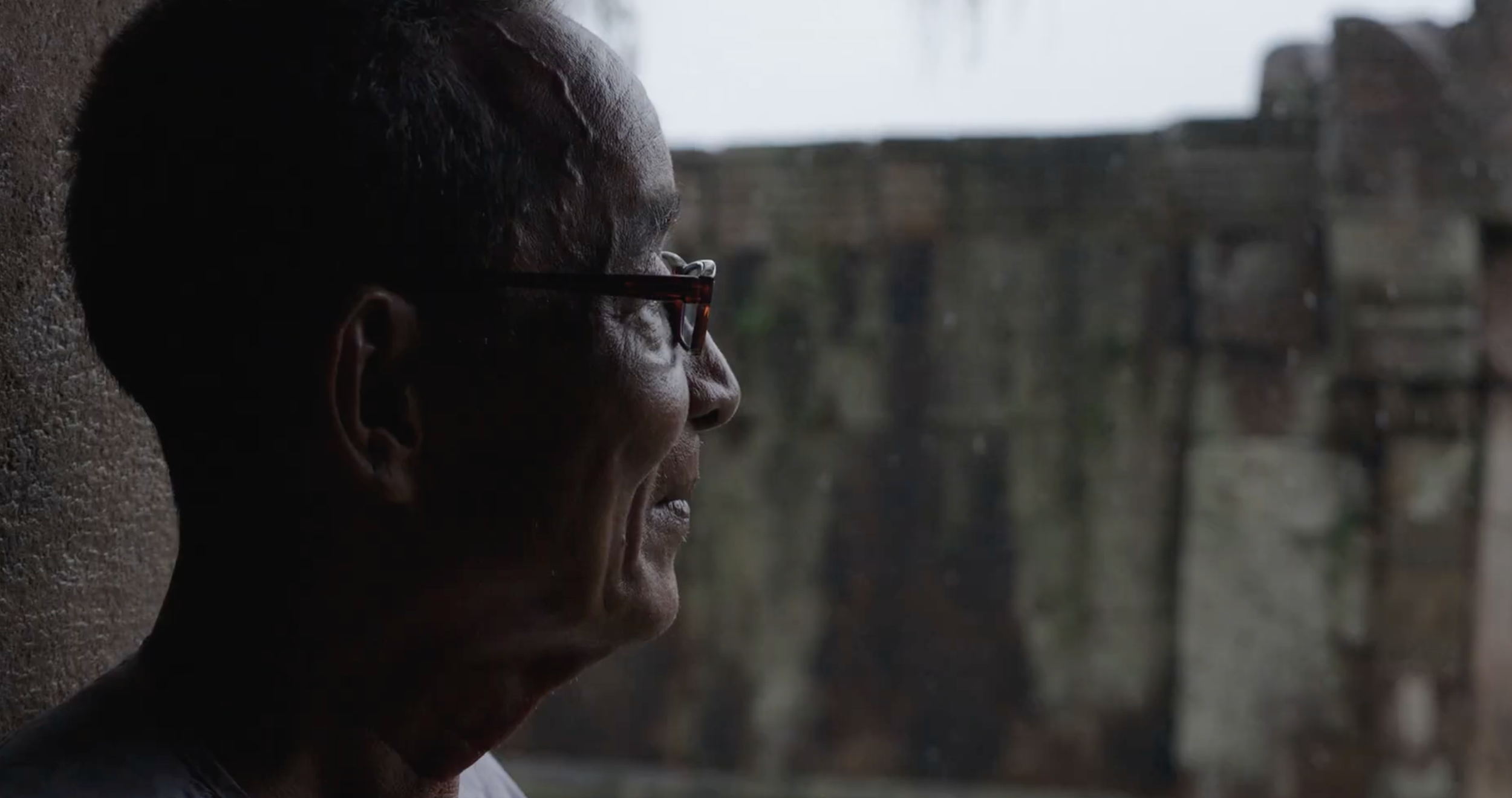 Documentary portrait of local man observed during on-location filming