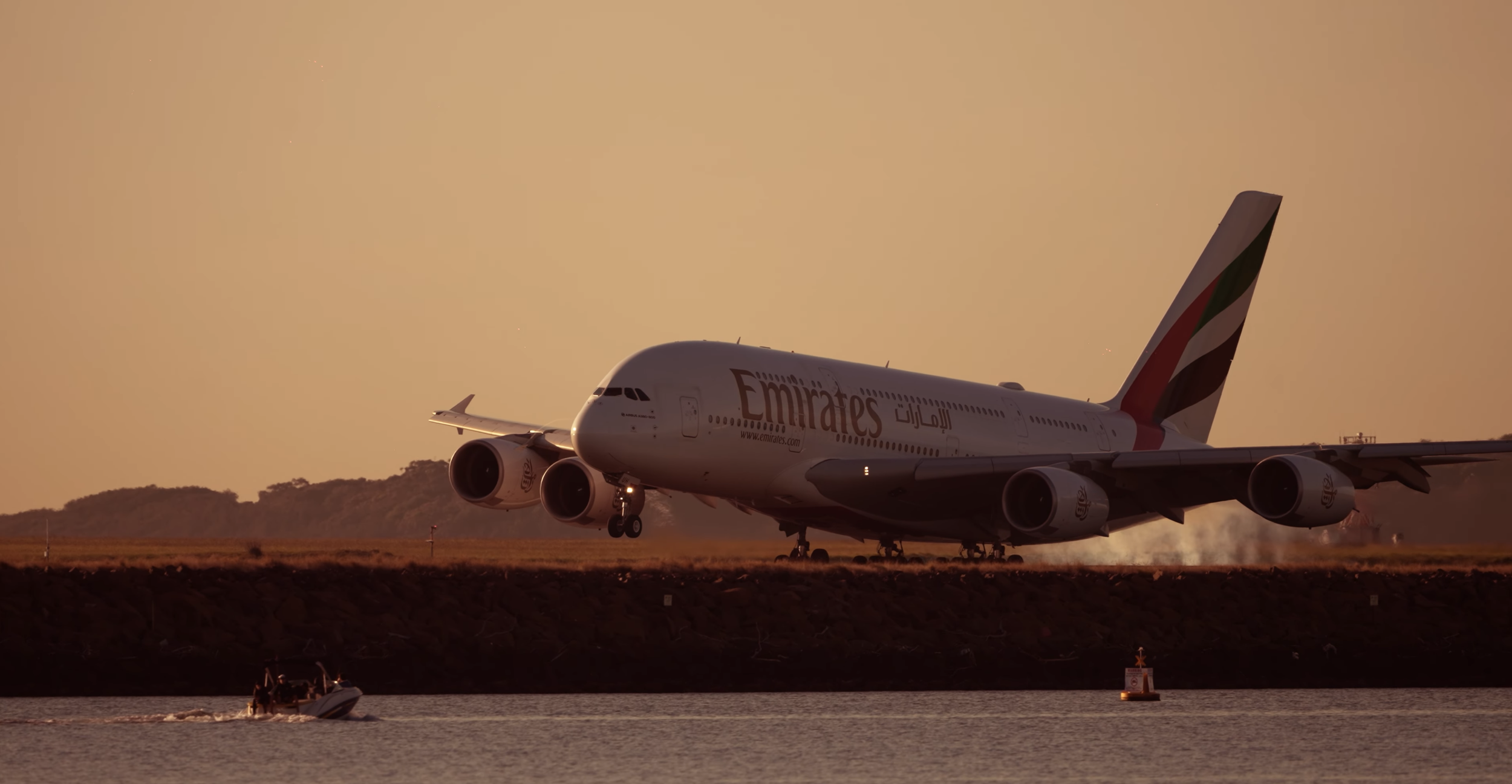 Emirates A380 landing filmed with telephoto aviation cinematography
