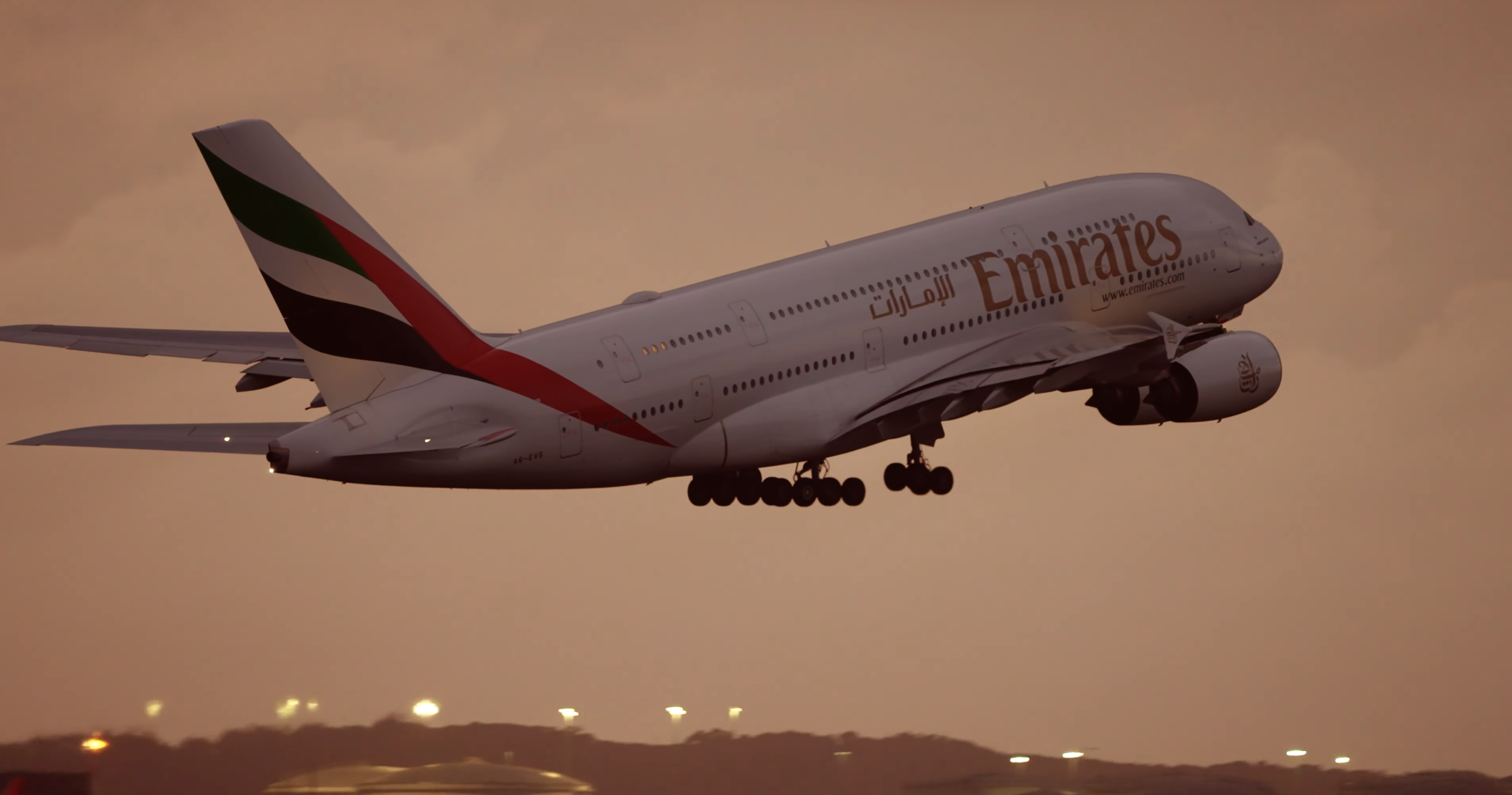 Emirates Airbus A380 taking off during golden hour aviation filming