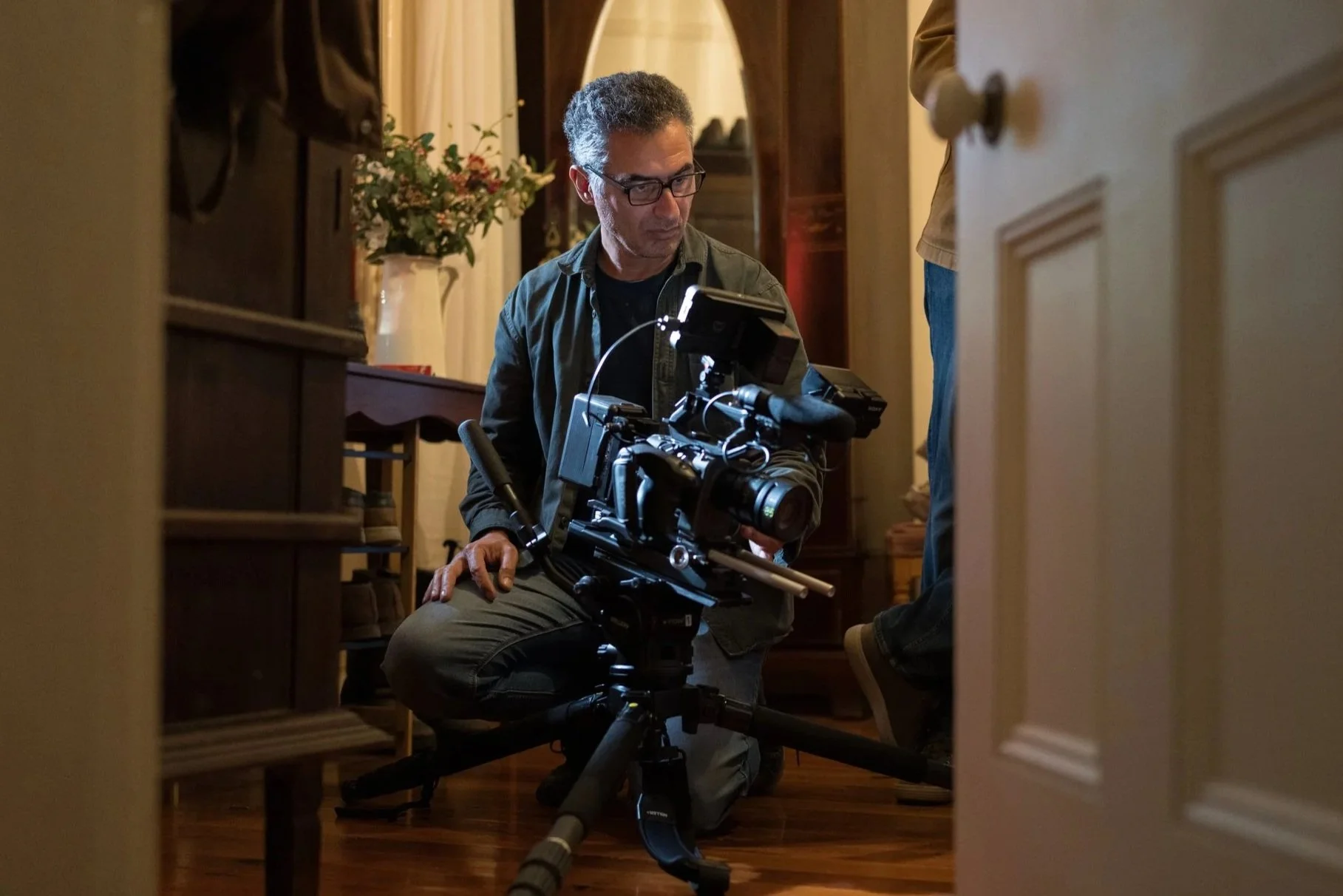 Morri Bigdeli Sydney-based documentary cinematographer operating cinema camera during filming