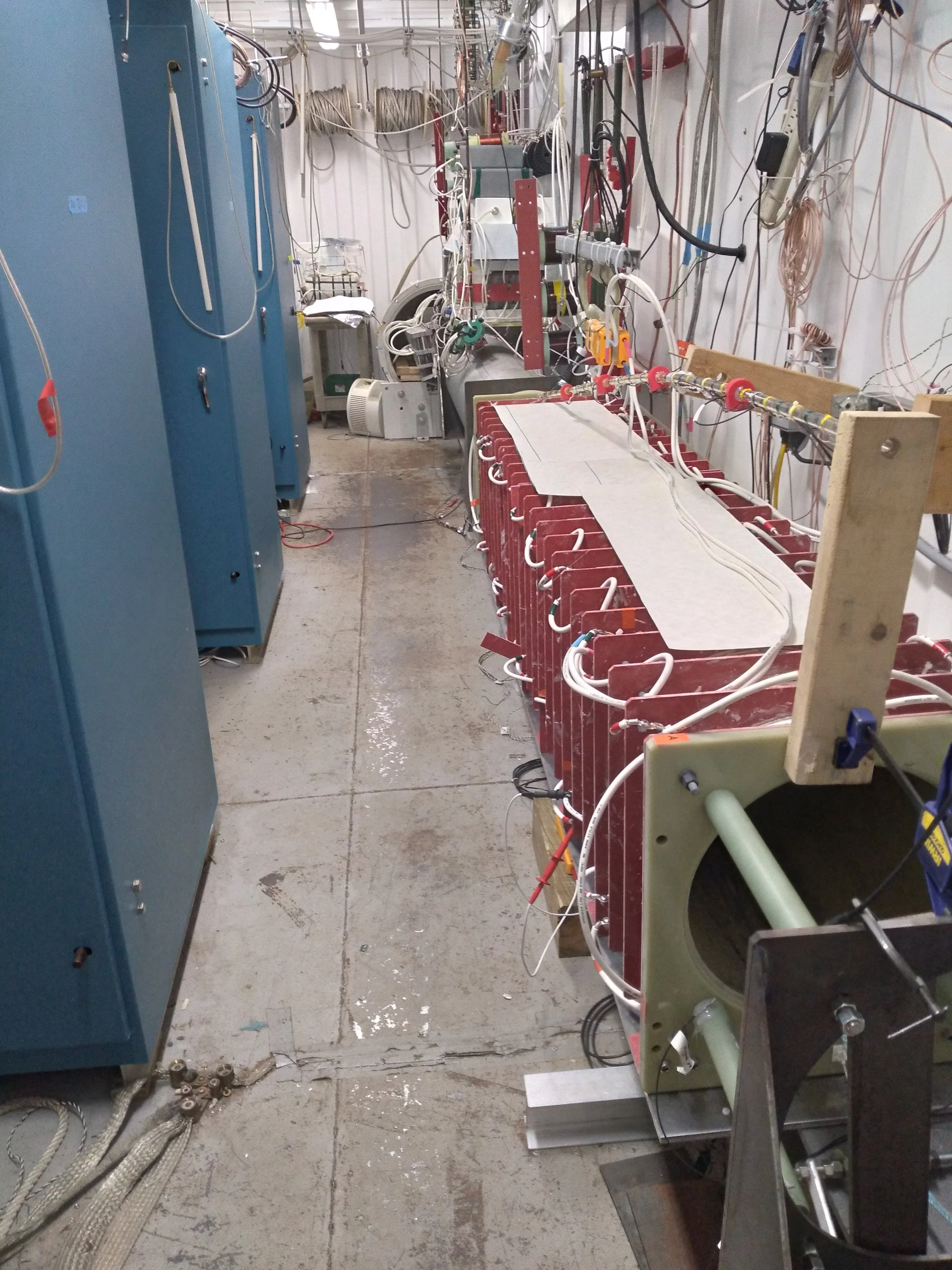 Inside the Conex container housing three 20 MW inverters and the electromagnetic launch barrel.