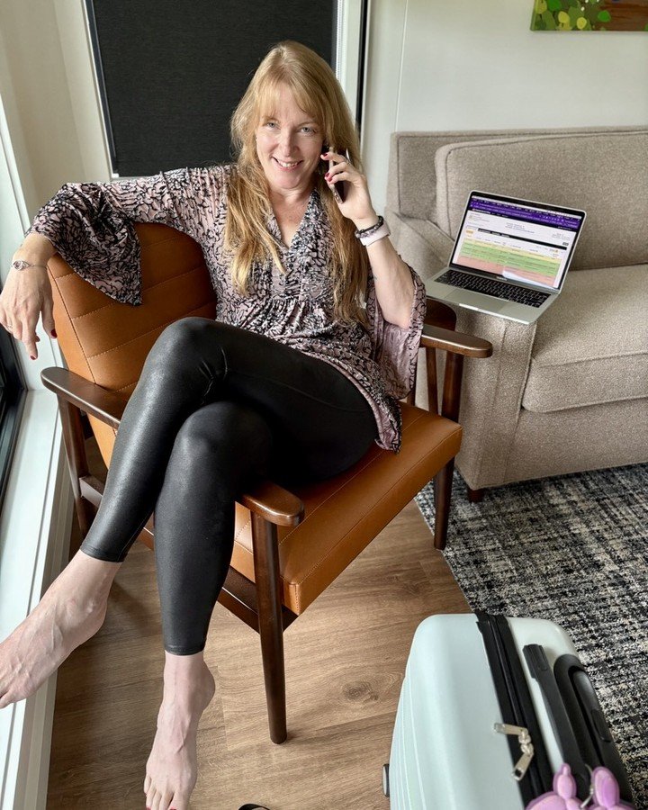 Christine of Everbound Studio on the phone with a brand