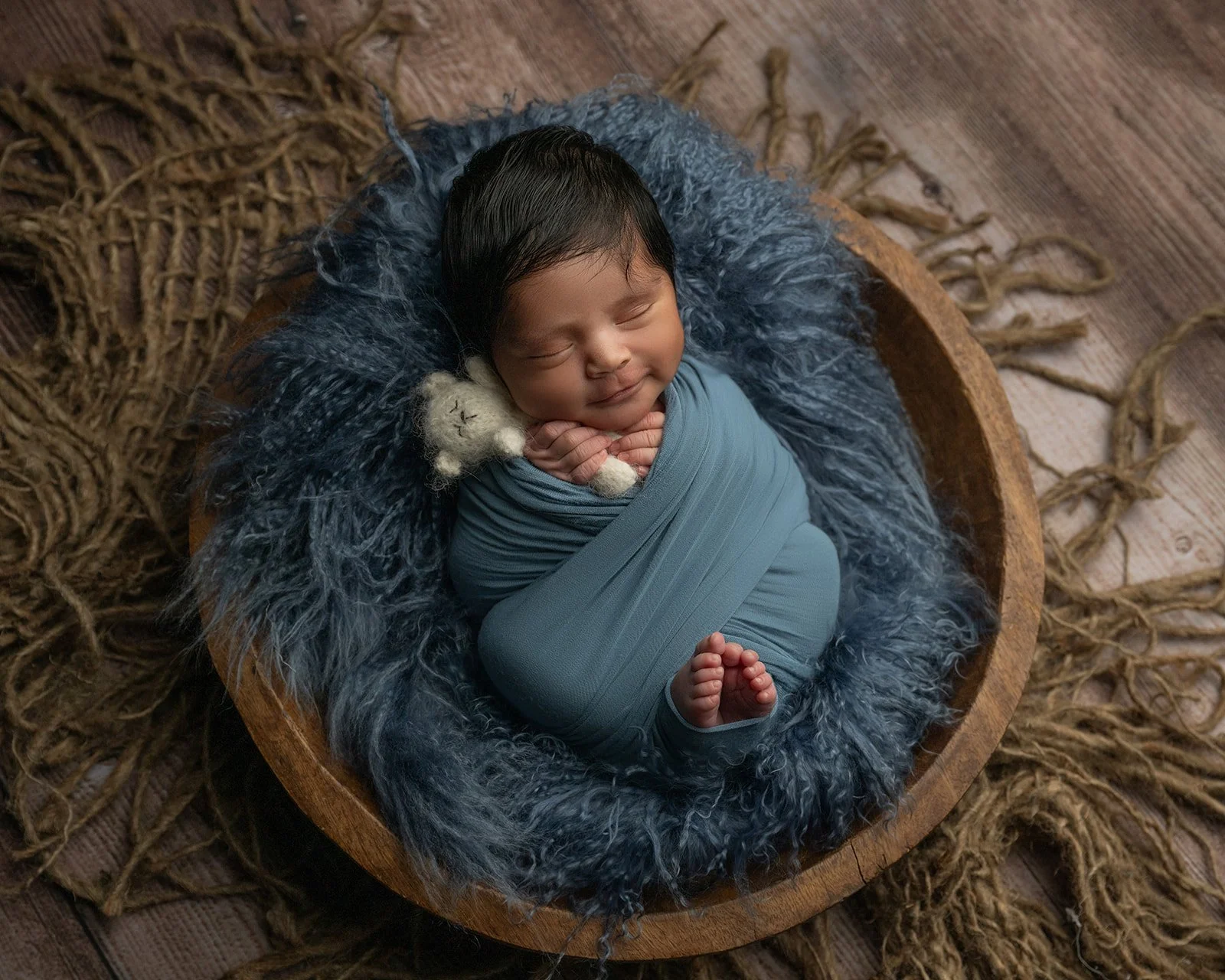 Sleeping newborn baby portrait photographed in a professional studio serving Houston and Cypress Texas families