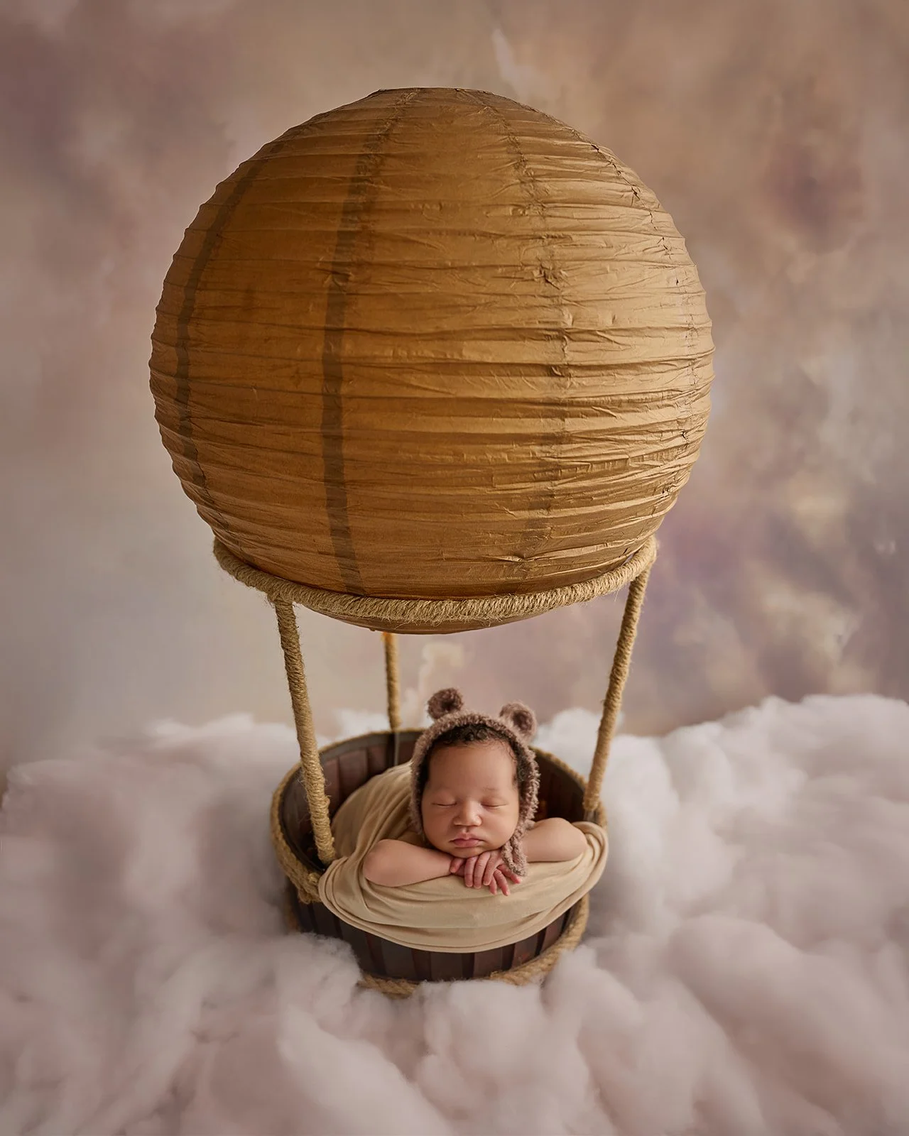 Studio newborn portrait capturing early moments of a baby photographed near Houston Texas