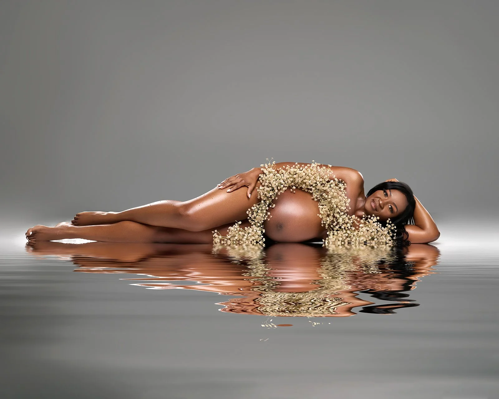 Studio maternity session with elegant lighting photographed near Houston Texas