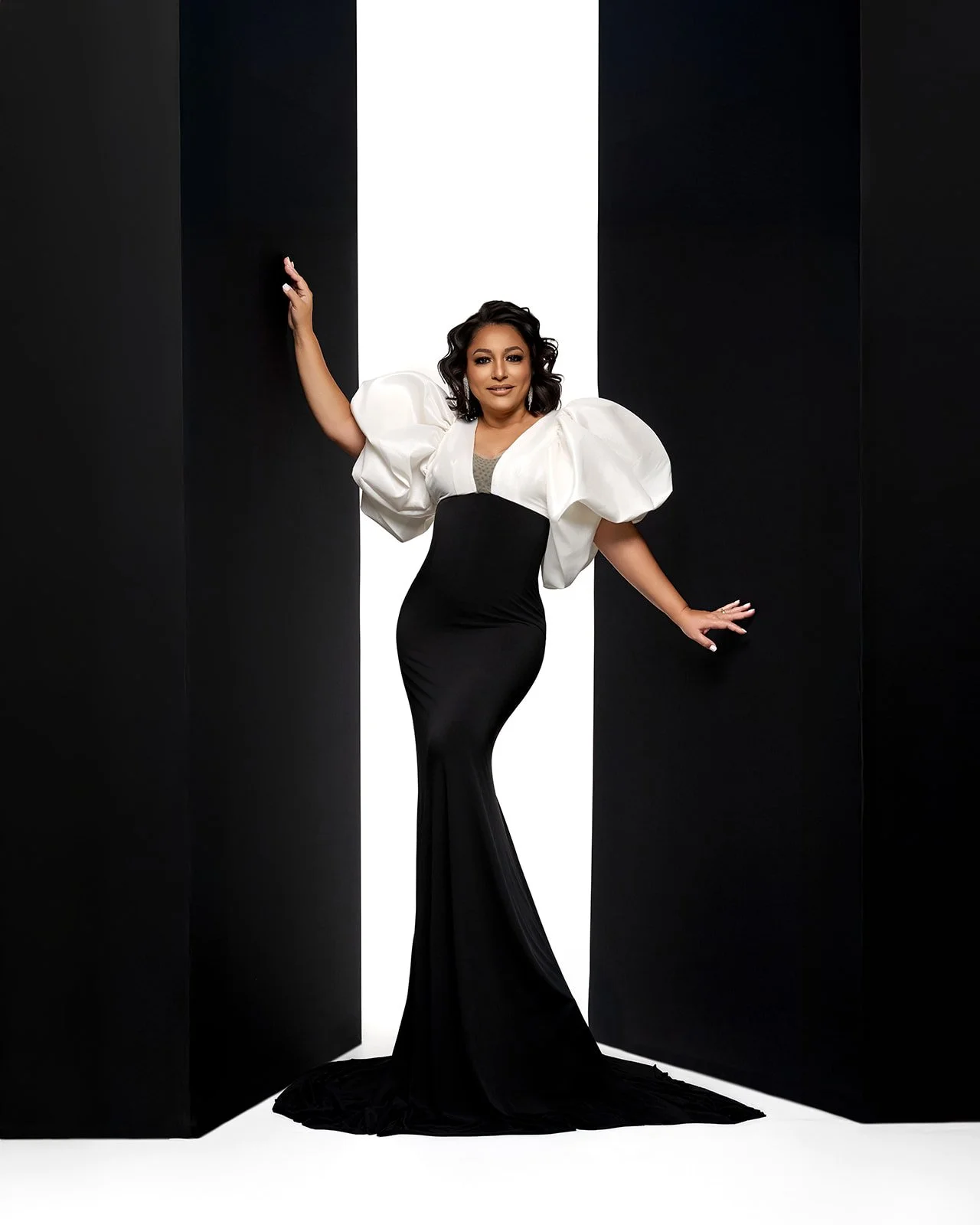 Graduate portrait with cap and gown photographed in Houston area studio