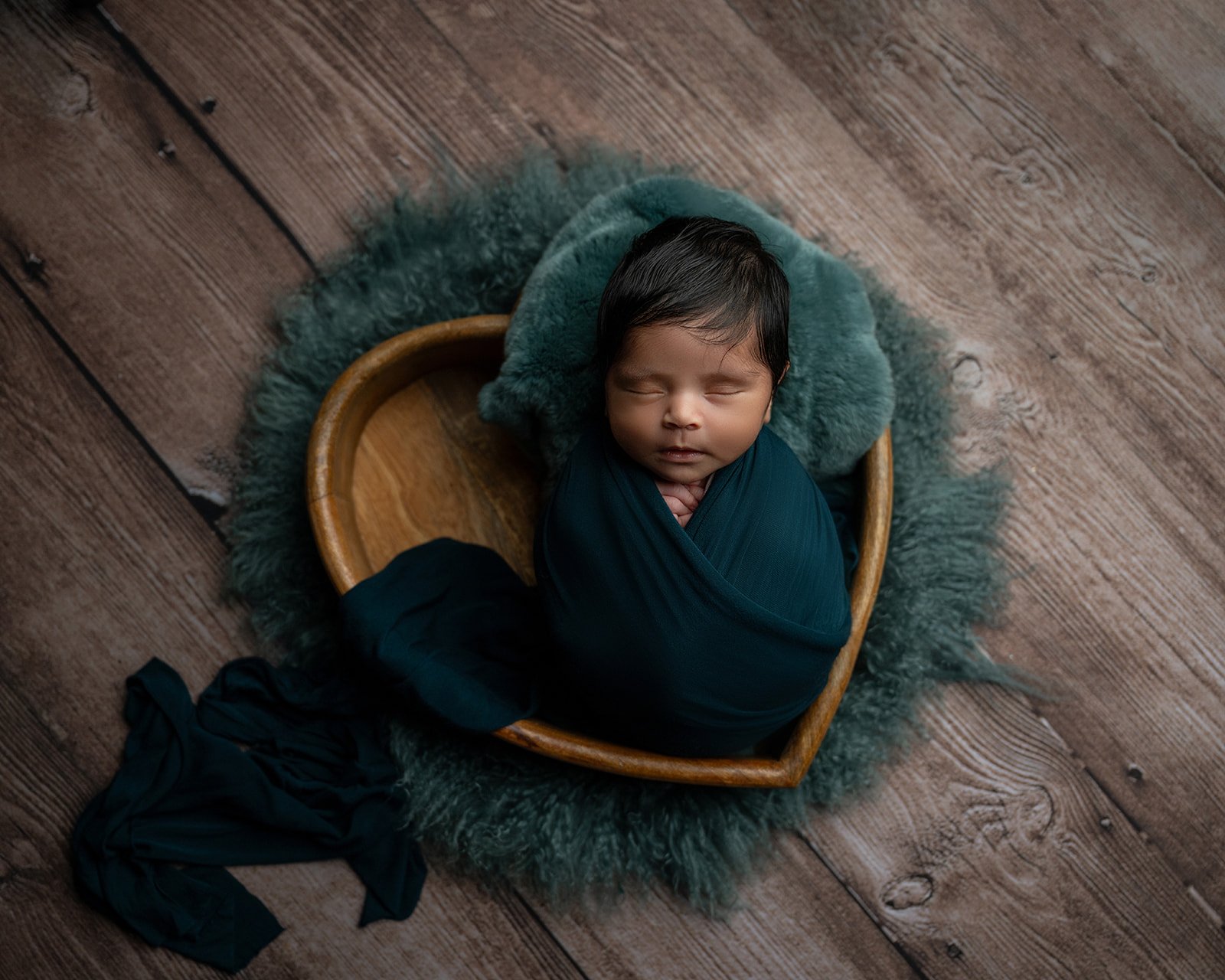 Elegant newborn portrait photographed with soft studio lighting in Houston area studio