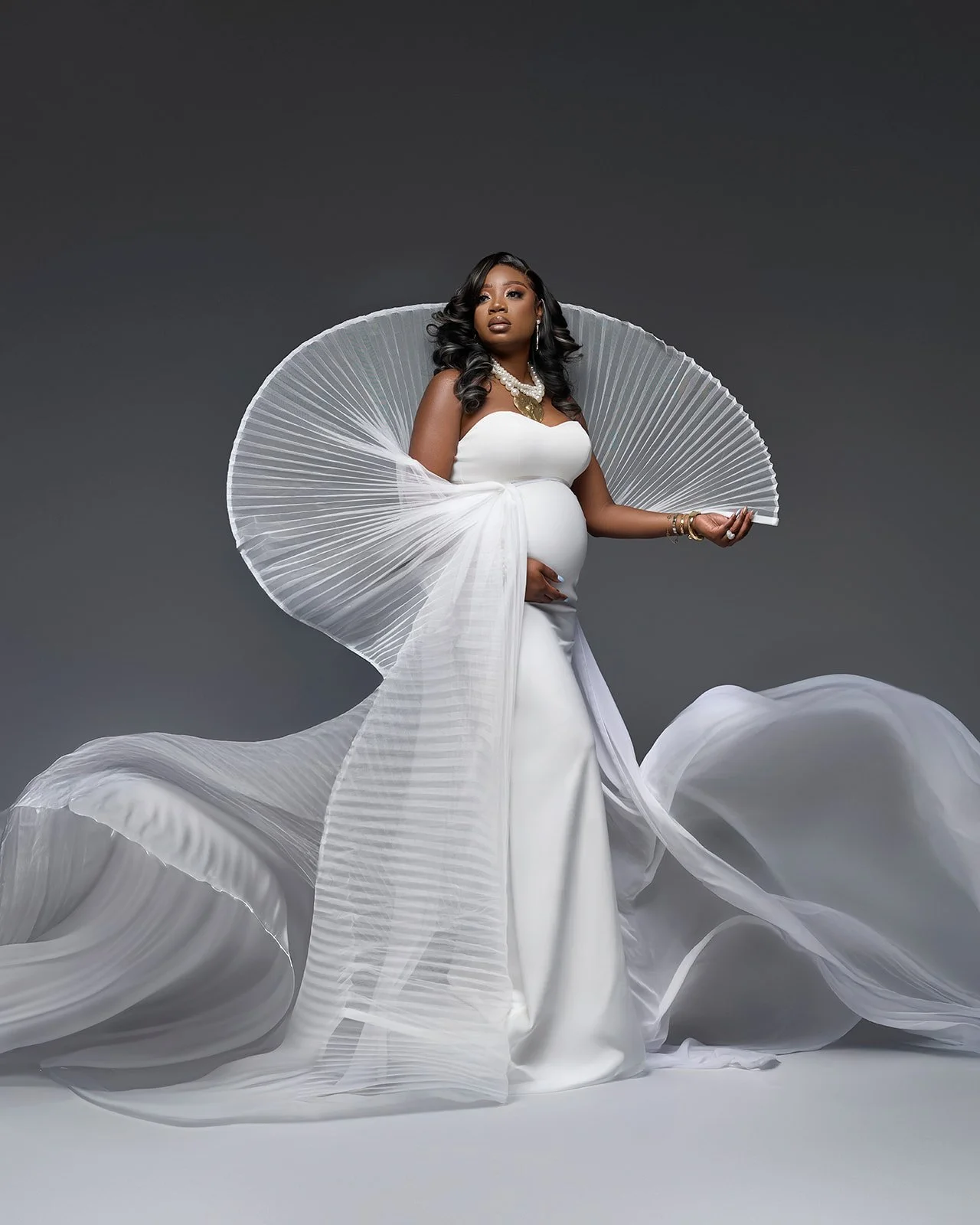 Fine art studio maternity portrait photographed by Houston maternity photographer in Cypress Texas