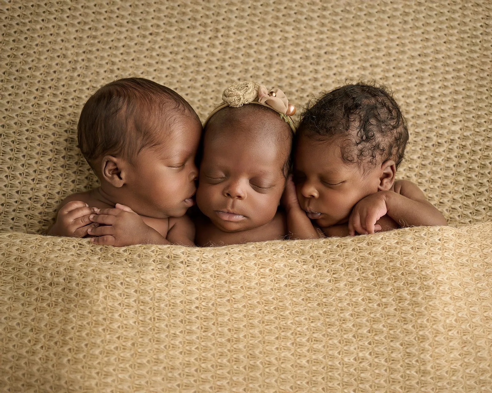 Studio newborn photography session capturing a peaceful sleeping baby near Houston Texas