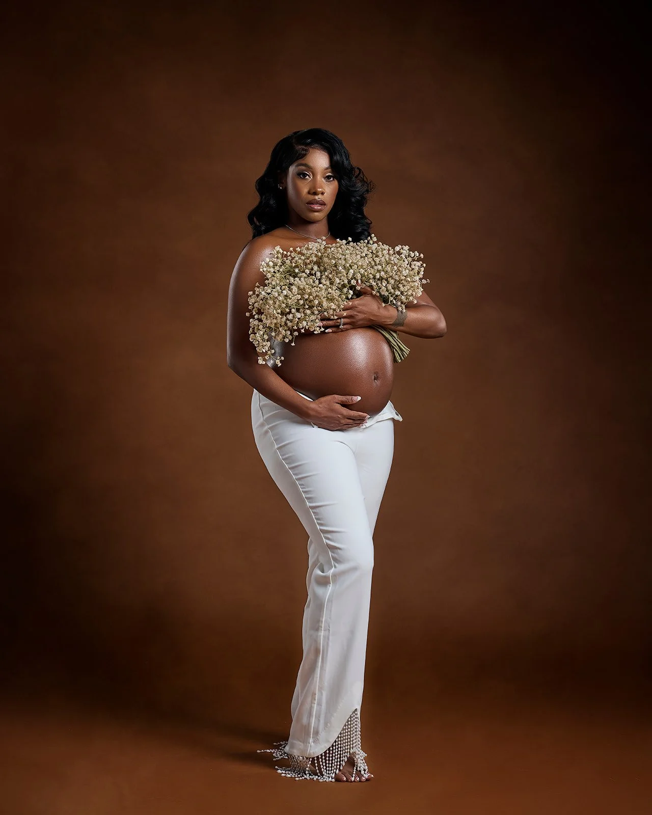 Studio pregnancy portrait photographed in Cypress TX serving Houston maternity clients