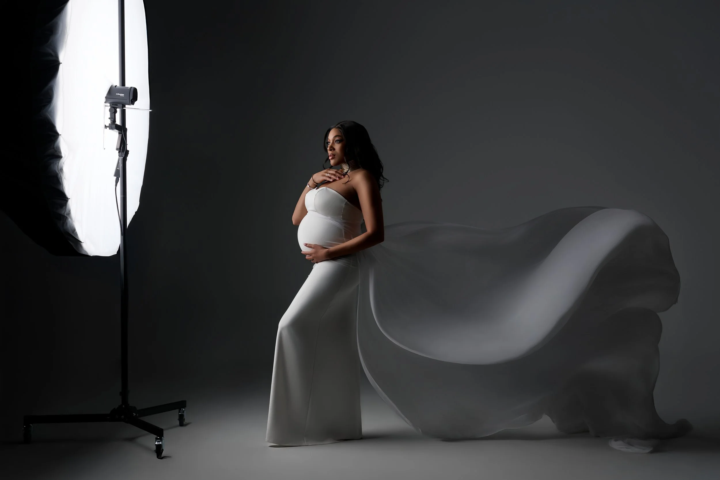 Luxury maternity photography with sculpted lighting in Houston studio