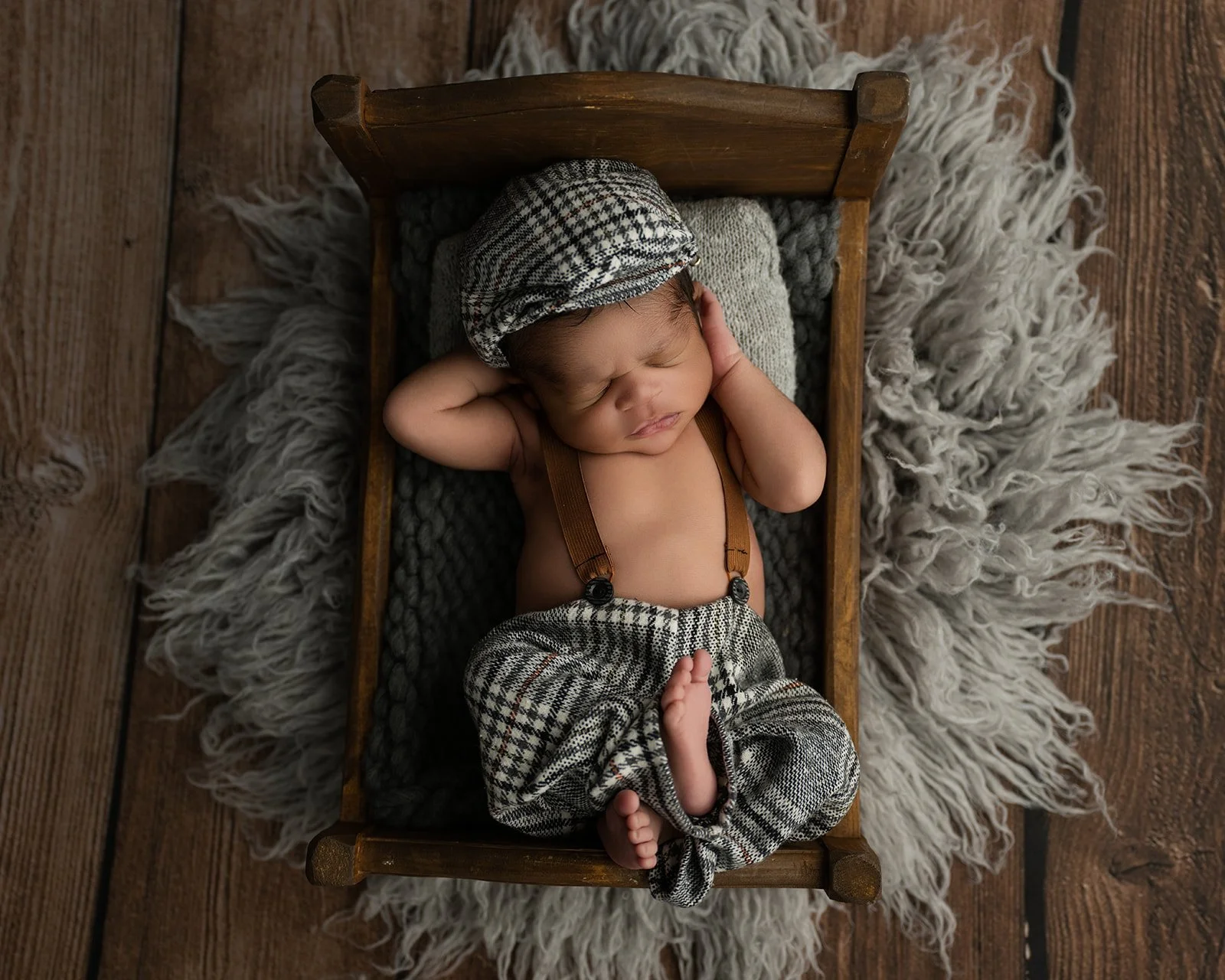 Peaceful newborn photography session captured in a professional studio environment