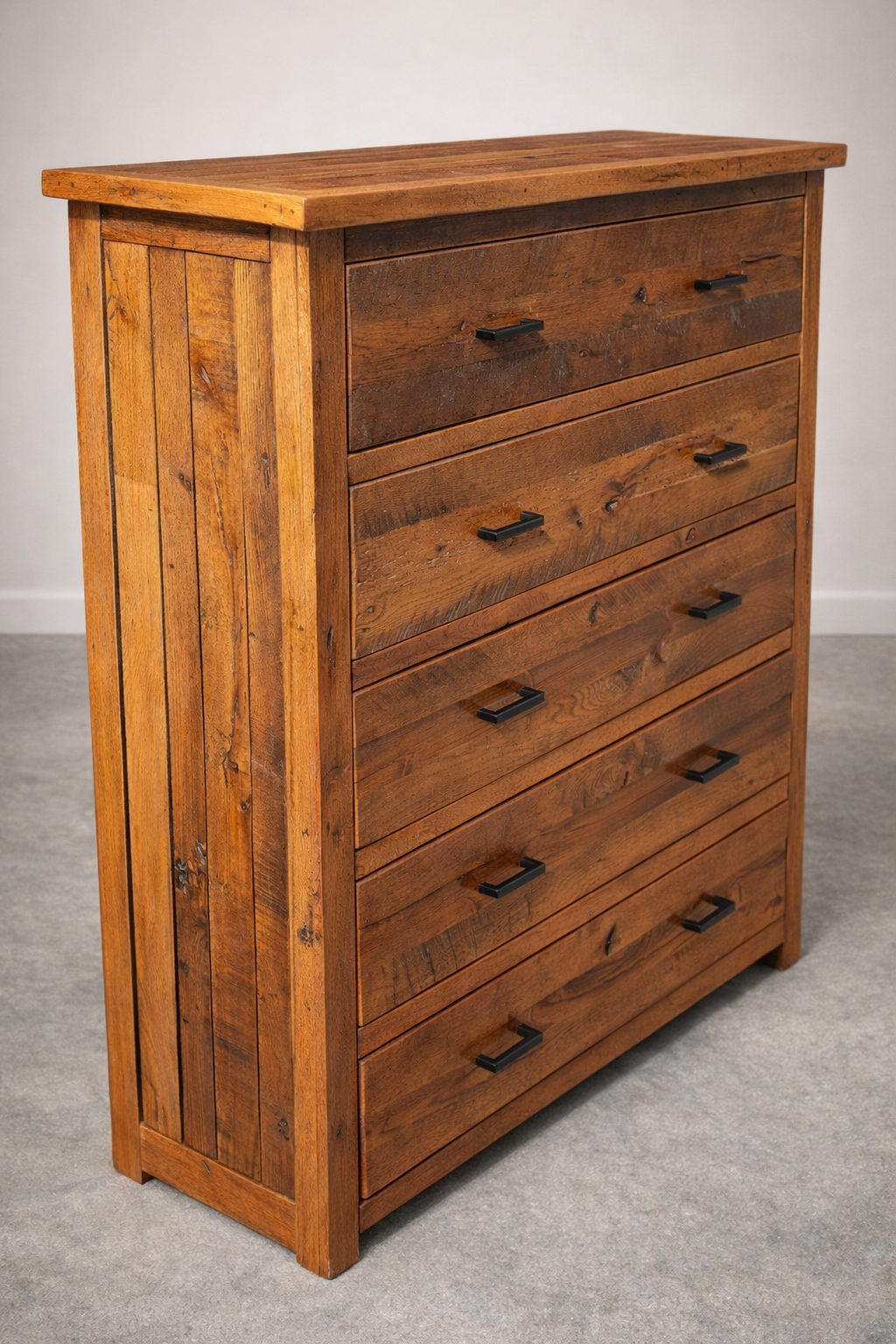 Handmade rustic dresser built from reclaimed barnwood with multiple drawers and metal hardware. A durable farmhouse-style storage piece with natural wood character.